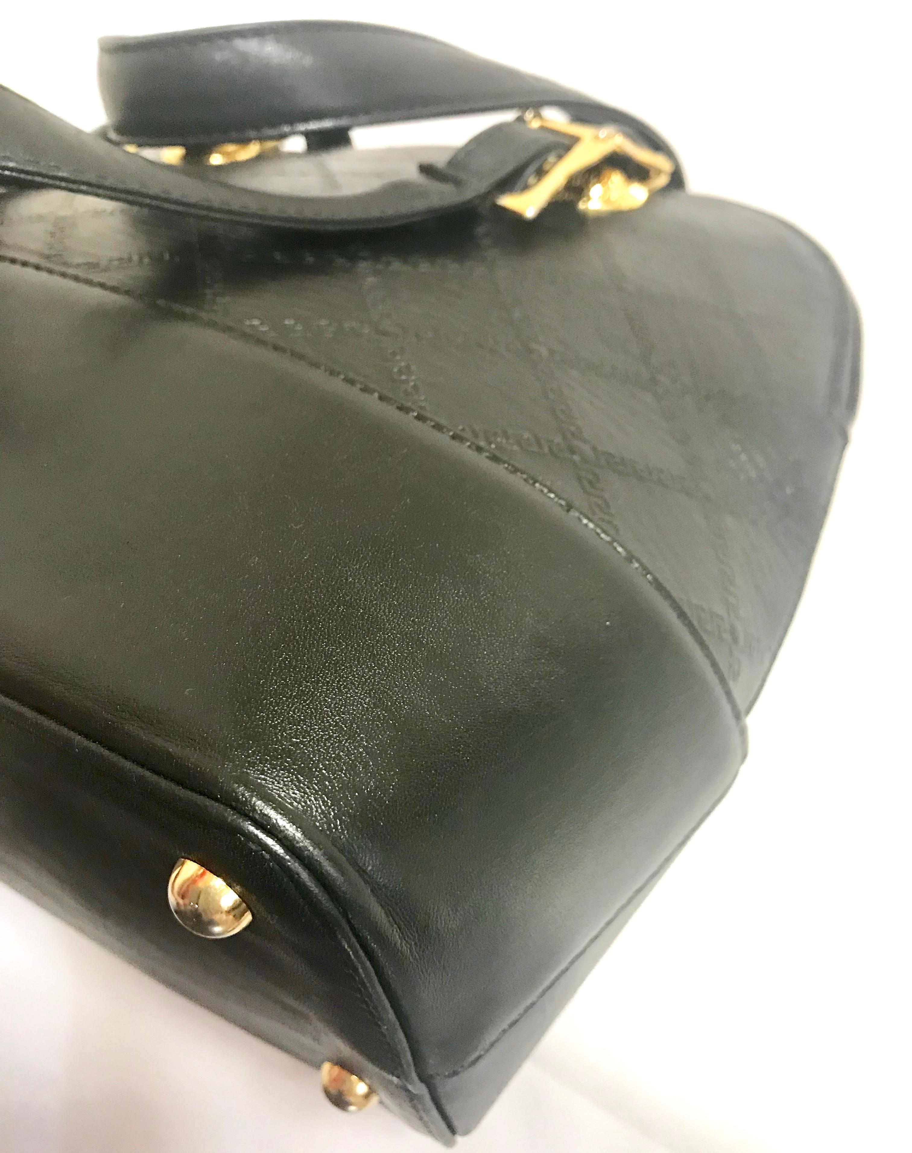 Gianni Versace Vintage black bolide shape bag with a tassel and sunburst motifs  For Sale 6