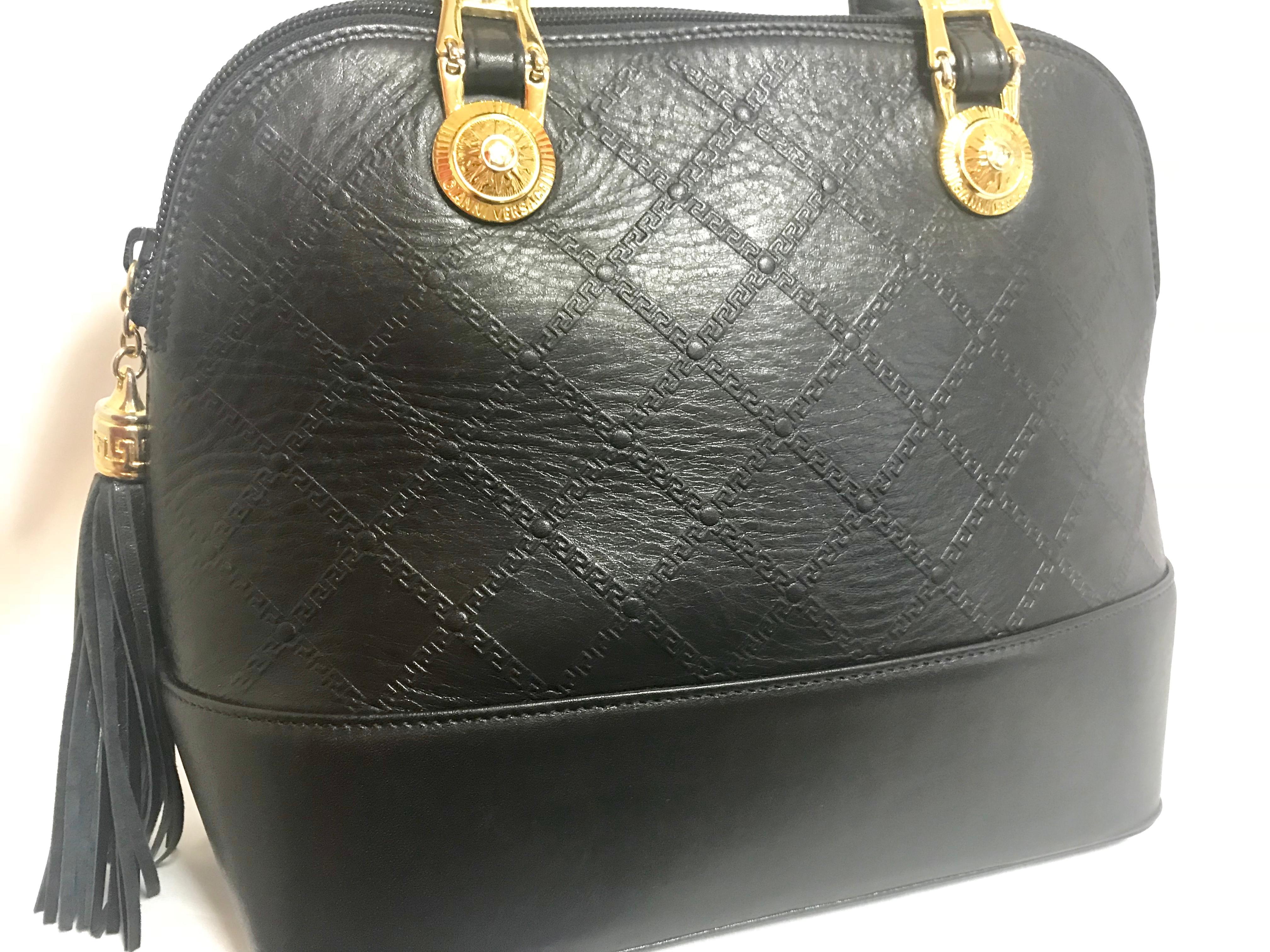 Gianni Versace Vintage black bolide shape bag with a tassel and sunburst motifs  For Sale 2