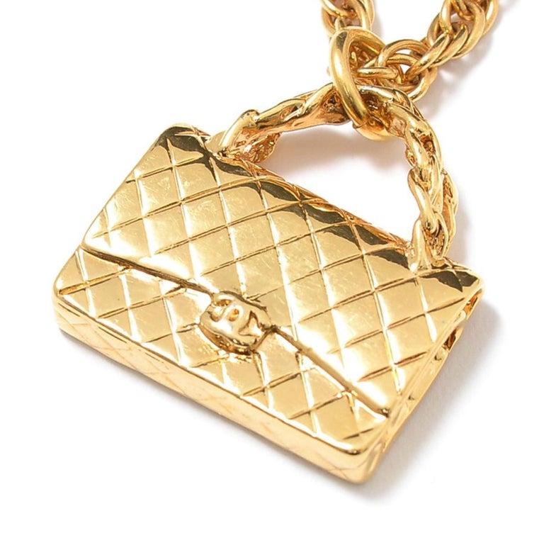 1990s. Vintage CHANEL golden chain necklace with classic 2.55 bag charm, pendant top.  Beautiful vintage condition.

If you are looking for a vintage jewelry from CHANEL back in the old era, then this is the must-have-masterpiece for