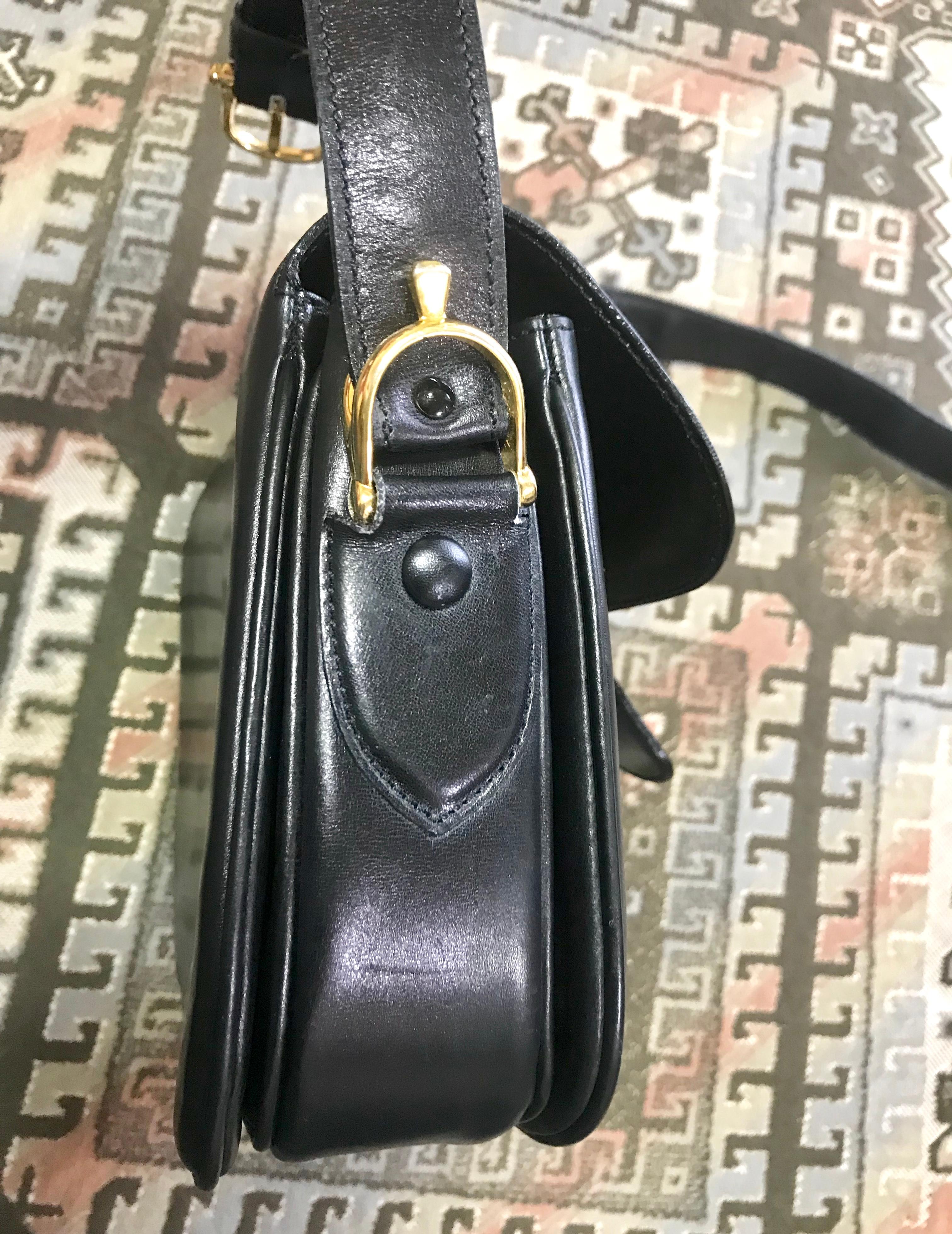 Vintage Celine black leather classic shoulder bag with golden logo closure. For Sale 1