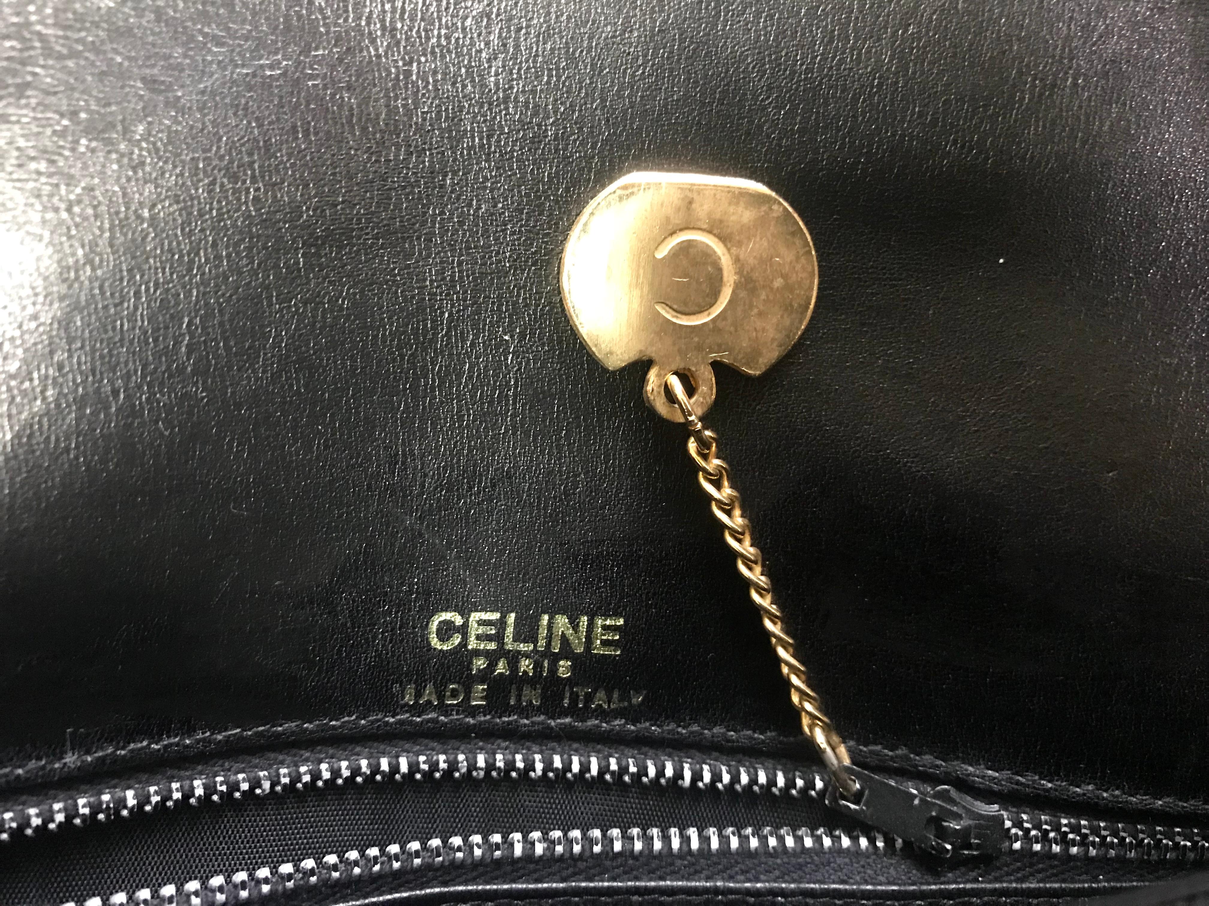 Vintage Celine black leather classic shoulder bag with golden logo closure. For Sale 8