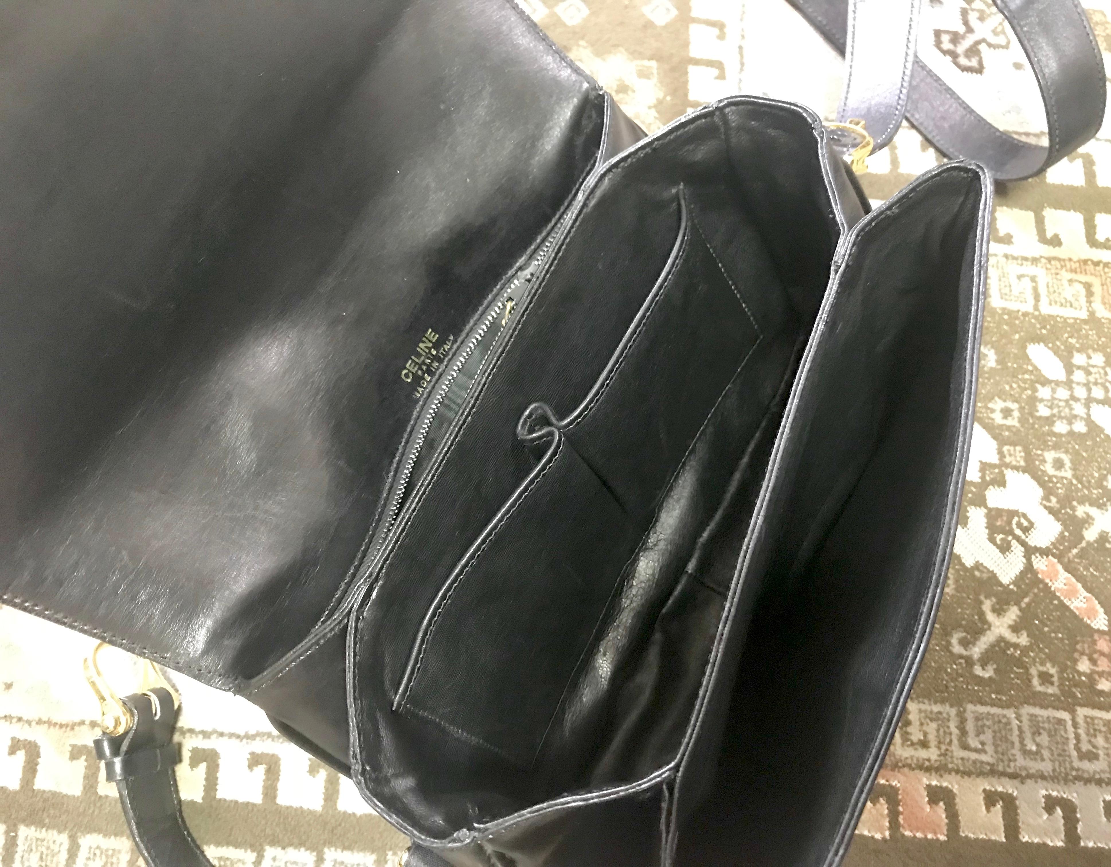 Vintage Celine black leather classic shoulder bag with golden logo closure. For Sale 7