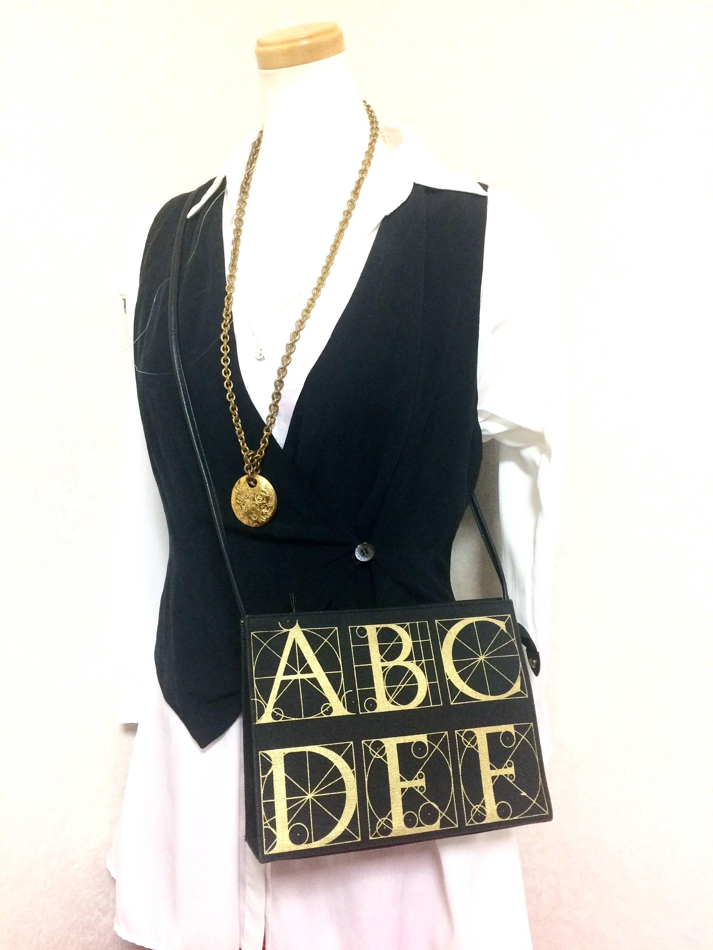 Vintage Paloma Picasso black shoulder bag with gold letter prints. For Sale 6