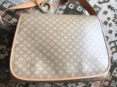 Vintage Celine beige macadam blaison pattern messenger bag with gold tone charm.