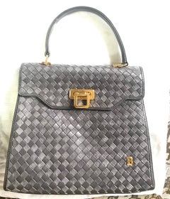 Vintage Bally taupe grey intrecciato leather kelly handbag with gold tone logo.
