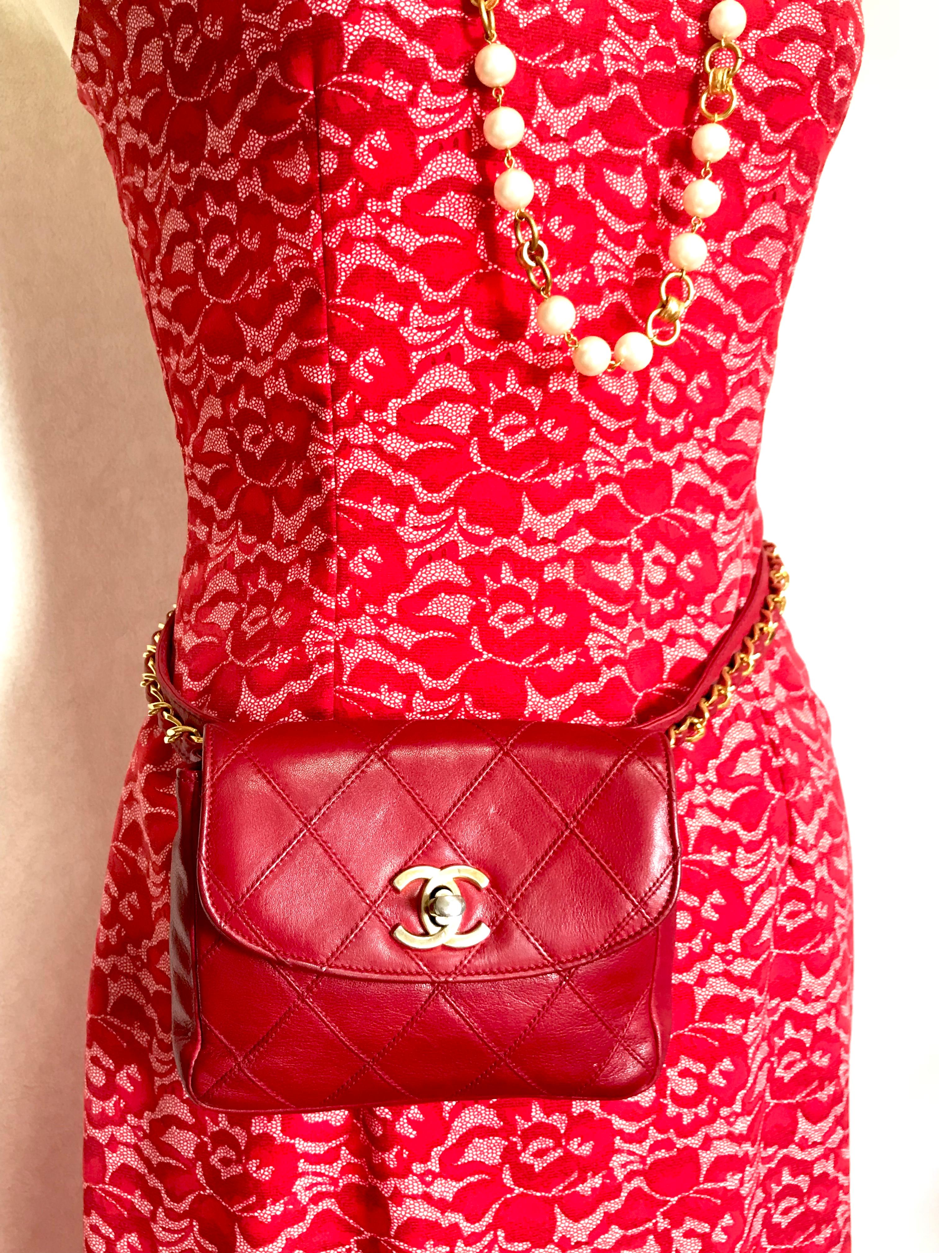 1990s. Vintage CHANEL lipstick red leather waist/belt bag, fanny pack with detachable chain belt and cc closure. Belt size would fit 24.8