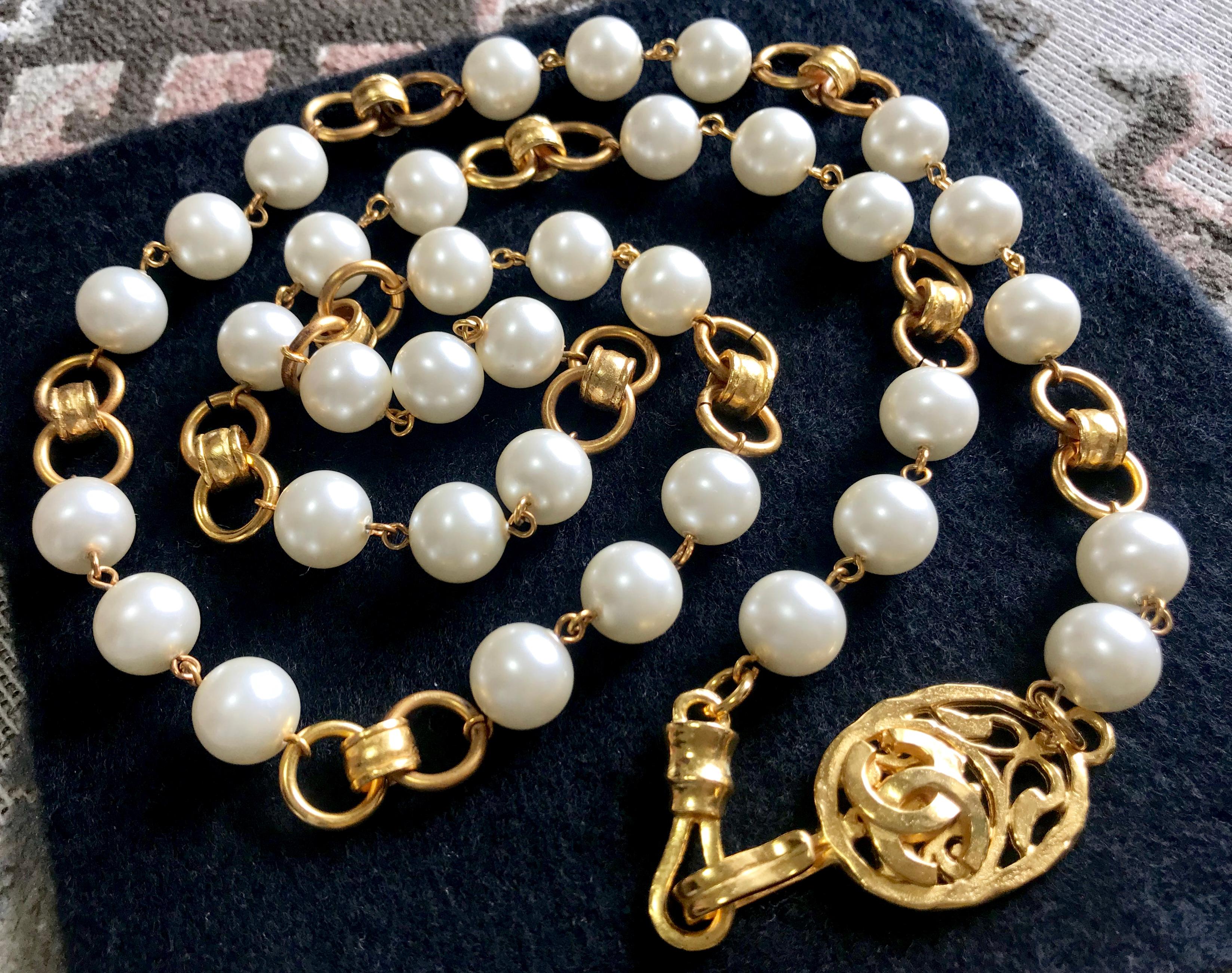 Women's Vintage Chanel golden long chain and faux pearl necklace, belt with CC mark.  For Sale