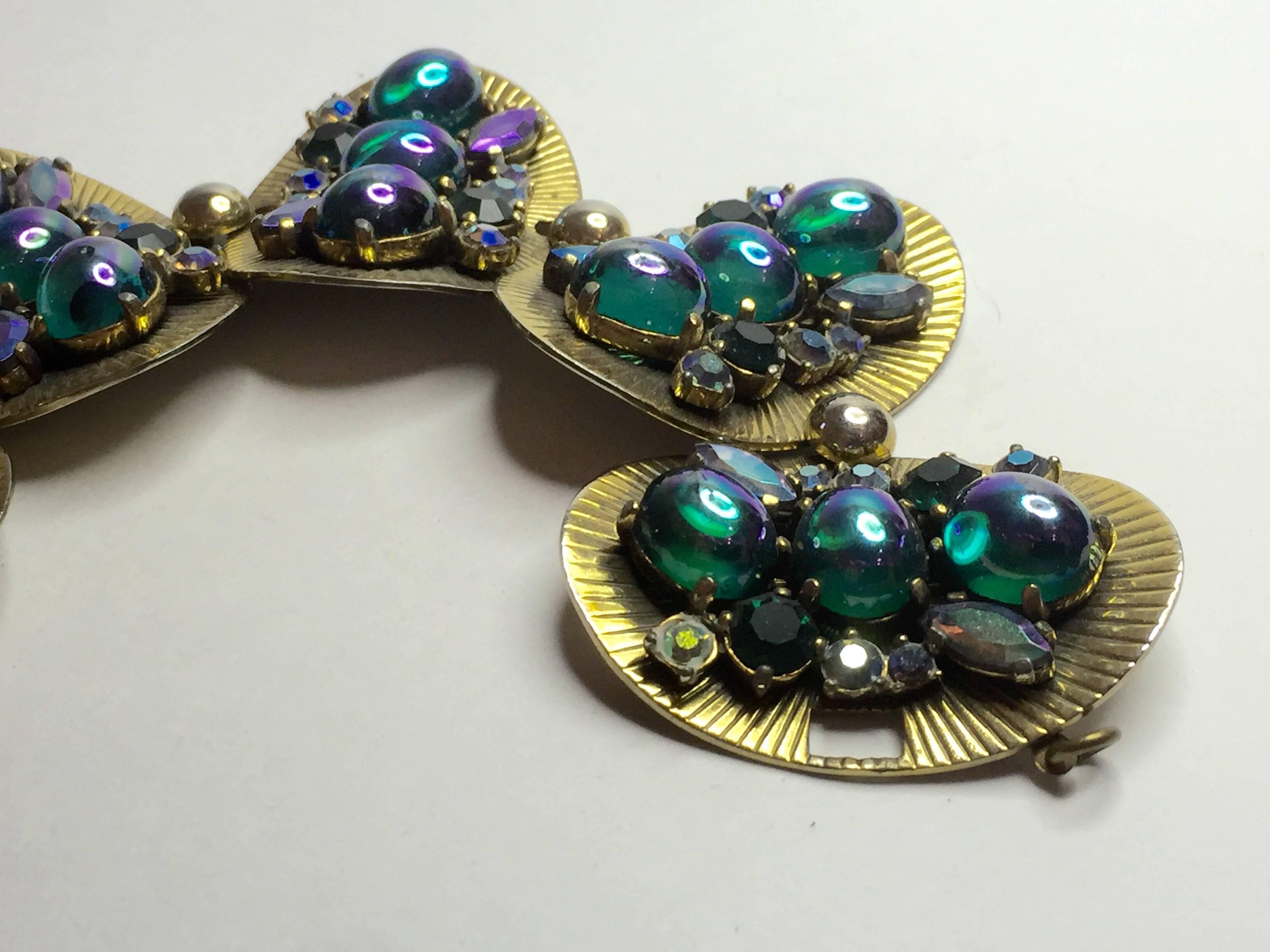 Women's Schiaparelli 1960's Pleated Goldtone Discs Bracelet with Faux Emerald Cabochon For Sale