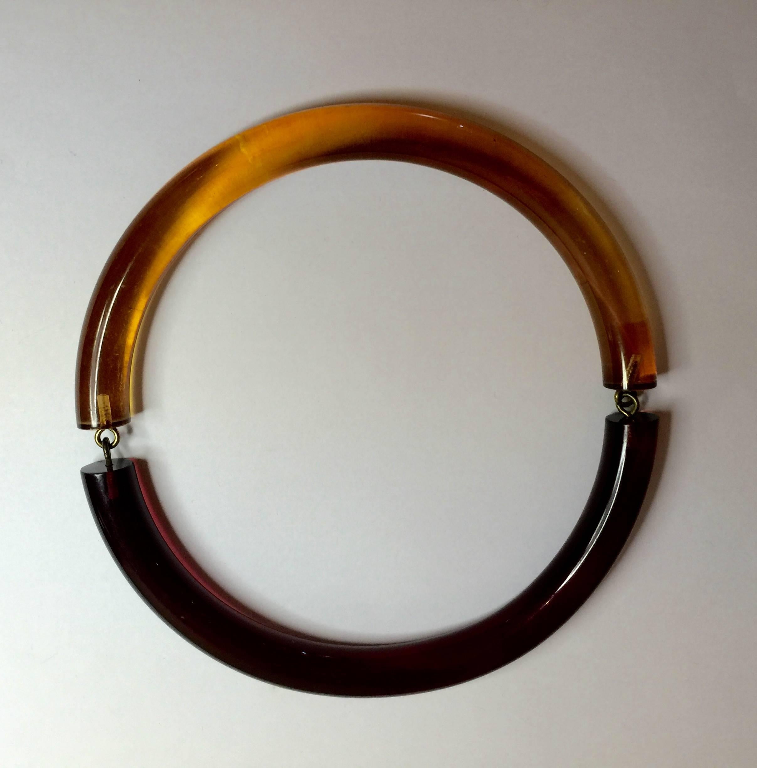 A classic vintage Judith Hendler Acri-Gems neck ring collar necklace. Simple, geometric, elegant. Half amber acrylic bottom, half deep purple acrylic top. Classic C-ring and O-ring closure always is on the wearer's left, but the necklace can be worn