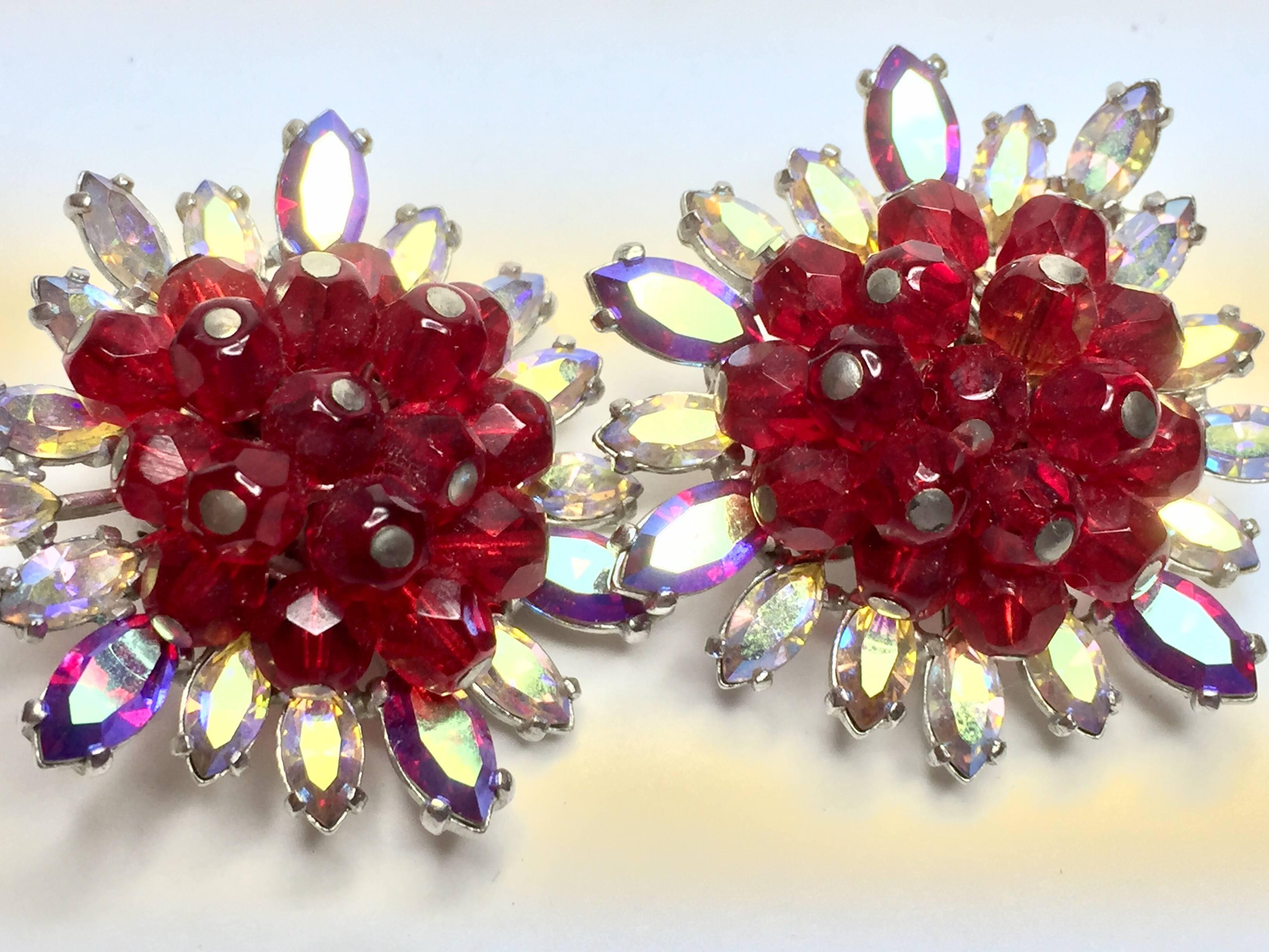 These SCHIAPERELLI  Faux Ruby earrings with  classic clip-on mechansism has elaborate LUXE Stonework ,and is a magnificent piece of designer vintage costume jewelry. Rhodium plated elaborate setting is embellished with aurora borealis marquis shaped