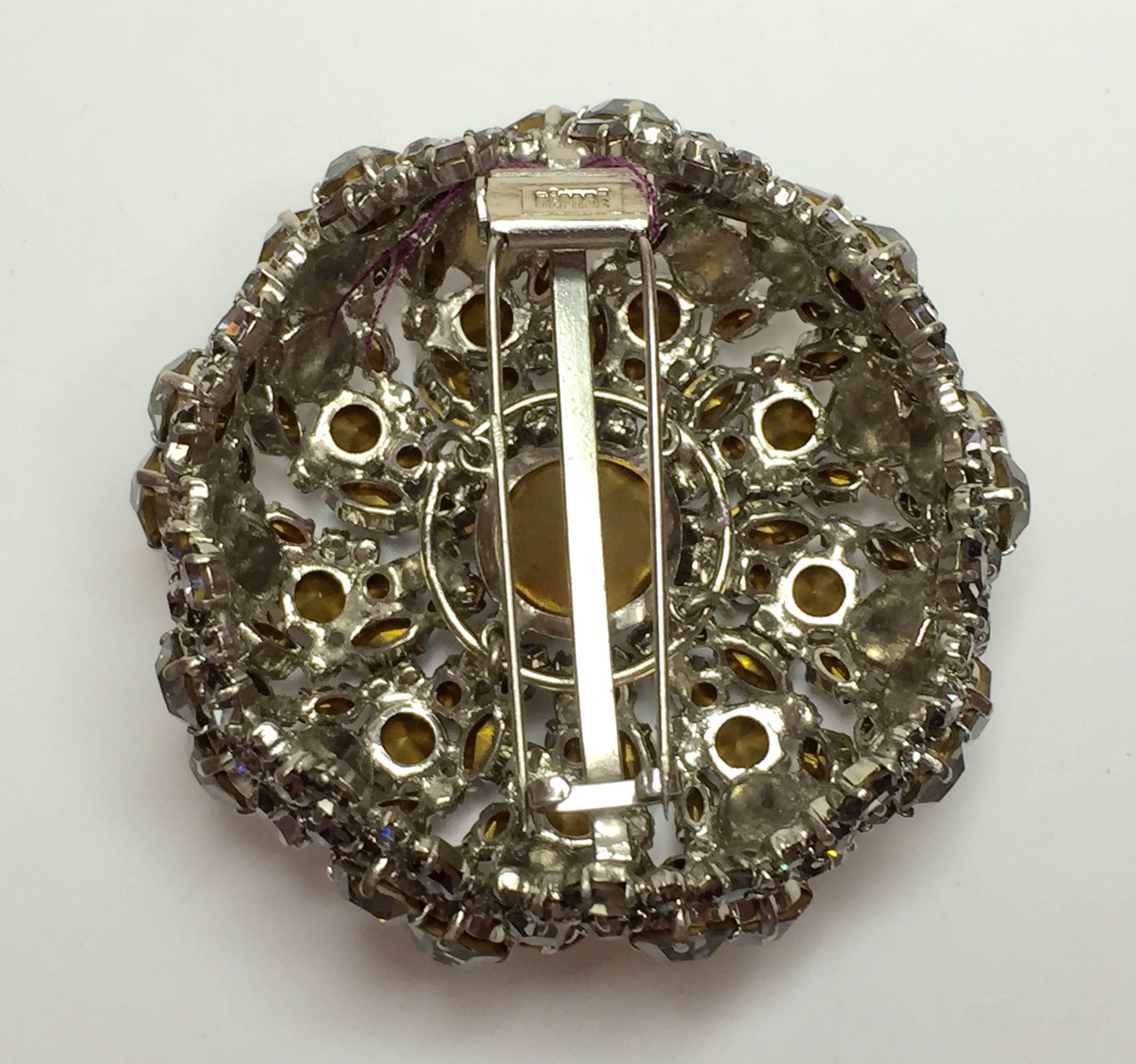 This wonderful FRENCH brooch, marked DEPOSE is widely attributed to acclaimed French designer Roger Jean Pierre. 1950's. Constructed in levels to achieve a high profile rounded puffy dimensionality, the circular swirling burst of glamorous smoke