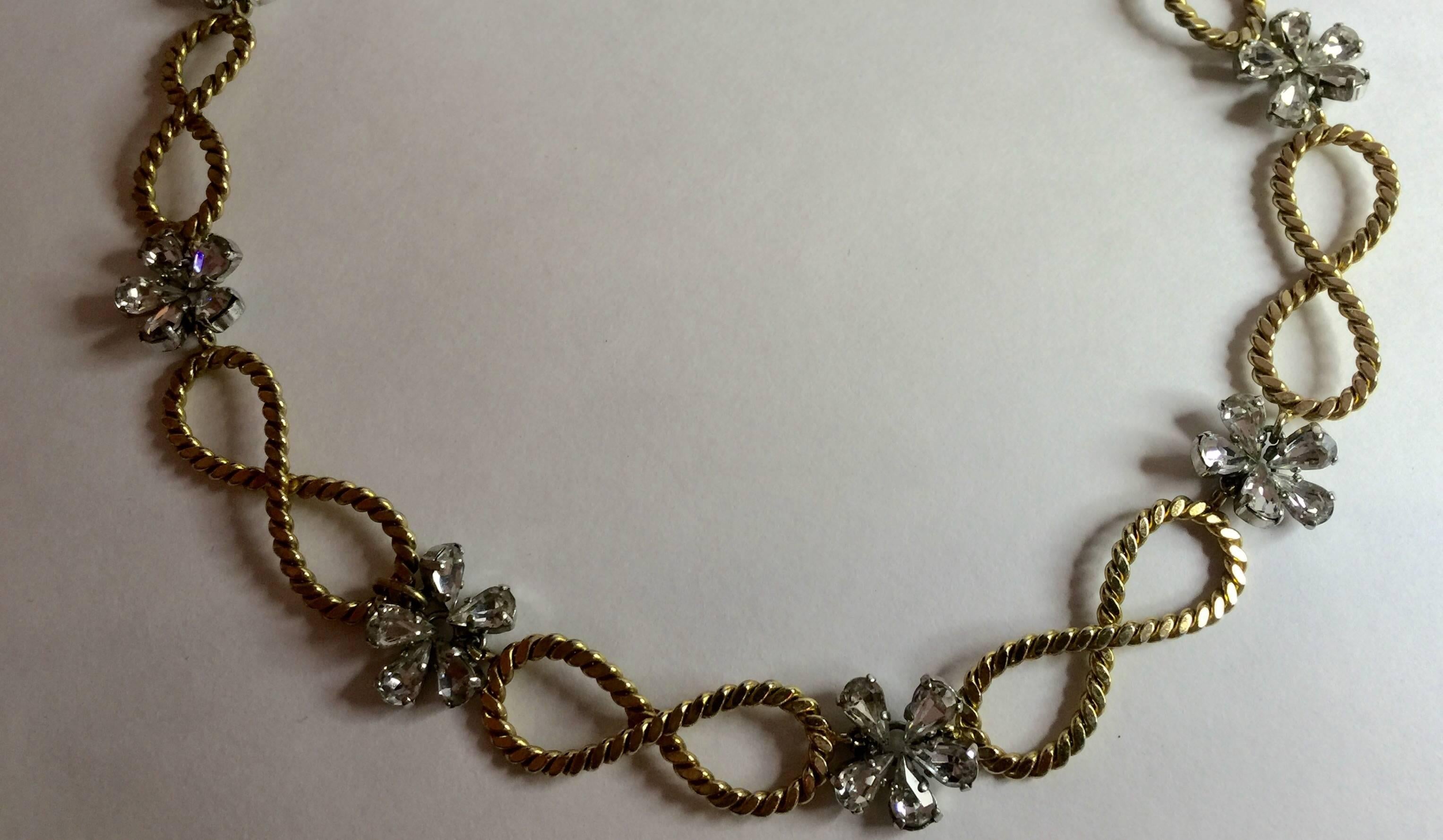 This 1950's CHRISTIAN DIOR Braided Looped and Floral Rhinestone Necklace is a lovely example of late 50's style , restraint and elegance in fashion. An era in the USA marked by Mamie Eisenhower's style and choices, this subtle, fine and small scale