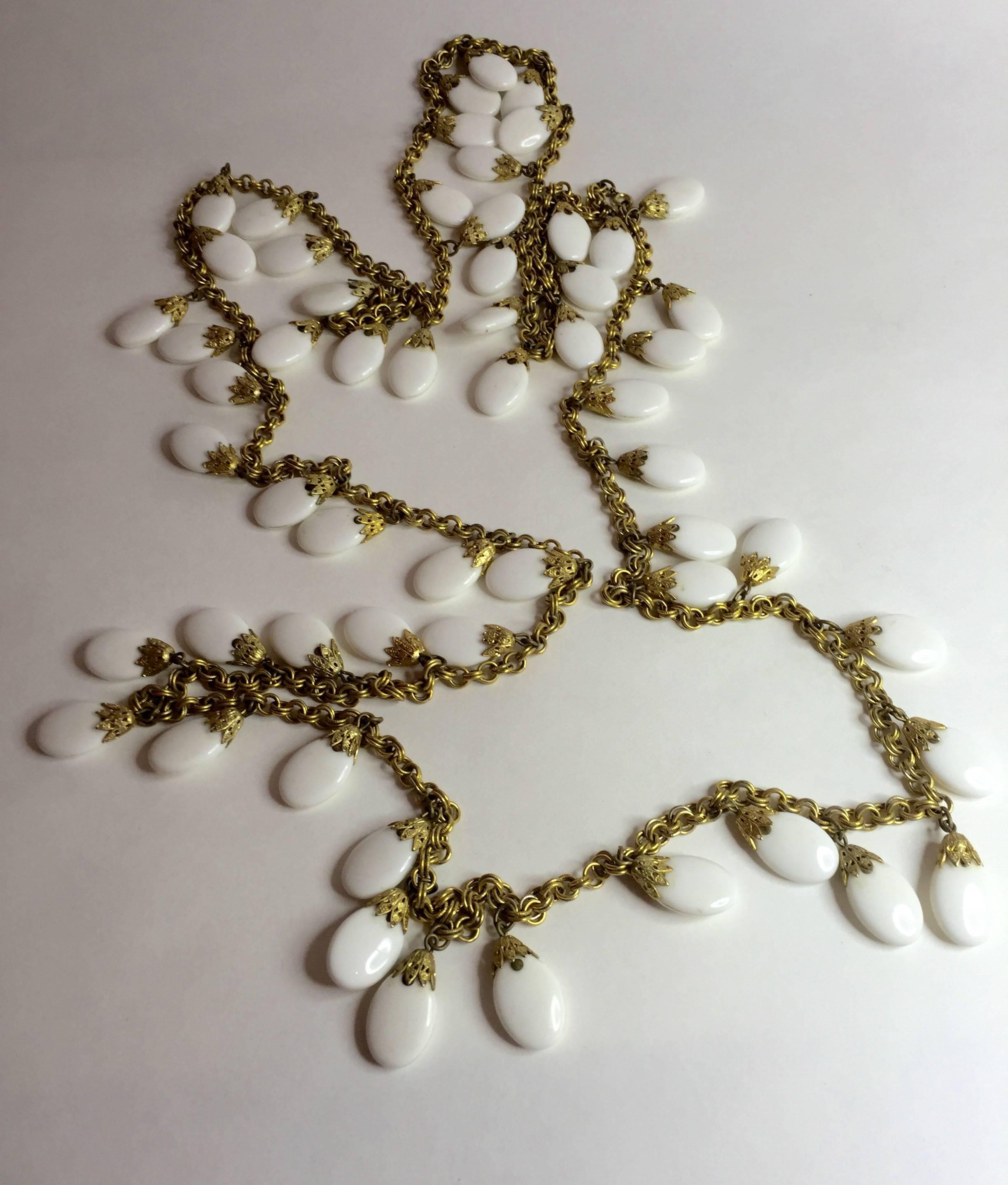 This 1960s NAPIER 82" Long Gold chain and White Resin Opera length Necklace/Earrings is a wonderful, wearable set by this well known and respected maker of fine costume jewelry. The stunning extra long length allows the wearer to wrap the