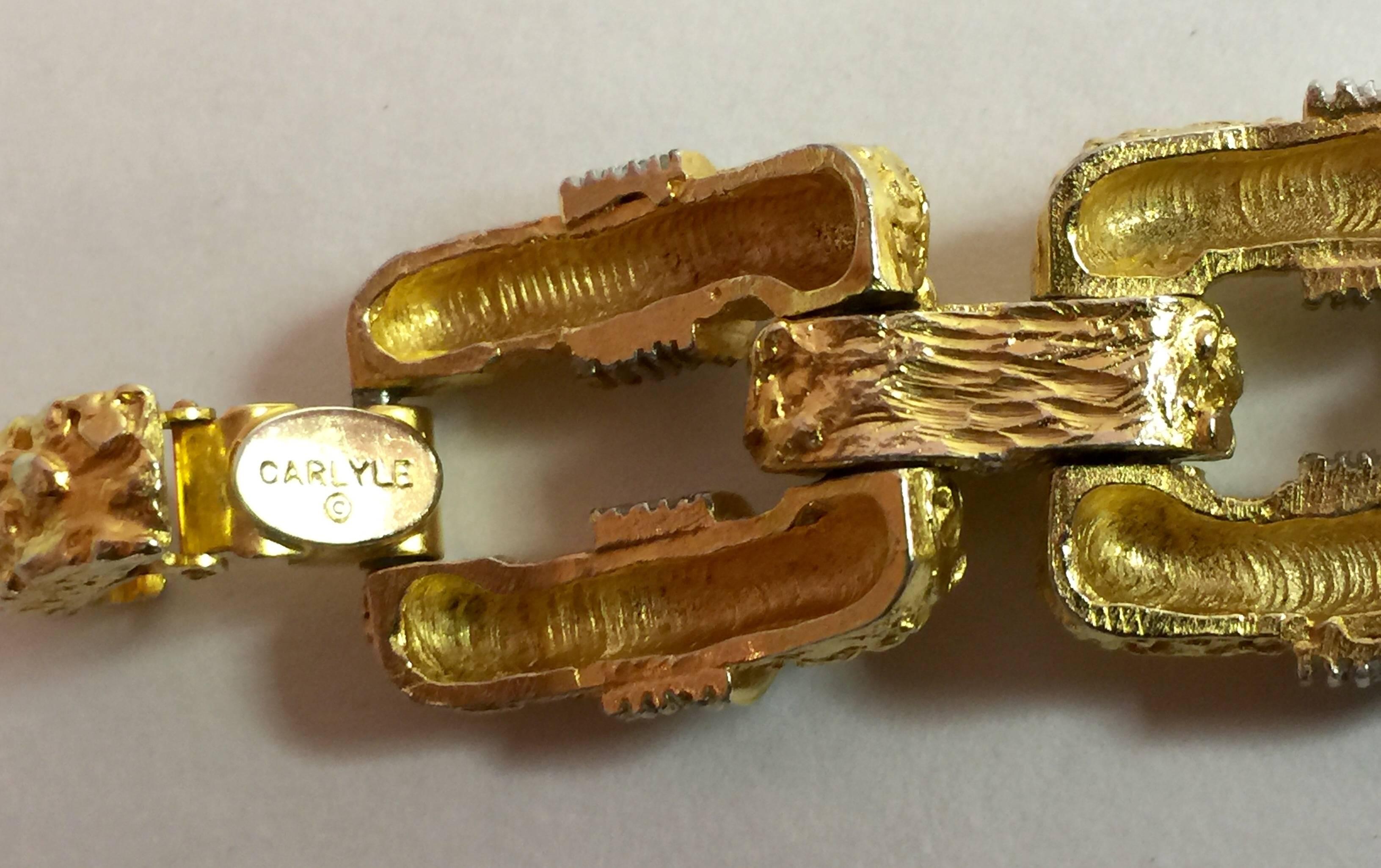 This 1960s CARLYLE Brutalist Goldtone and Pave Rhinestone Link Bracelet exhibits all the organic naturalist quality that textured goldtone jewelry  of this era is known for, and combines it with elegant rectangular classic link work and detailed