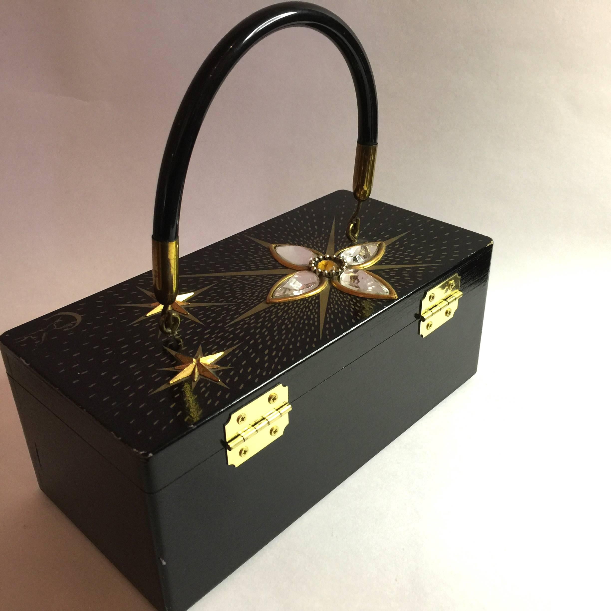 This totally Fabulous 1960s Enid Collins of Texas STAR DUST Black Wooden Box Bag Purse is a rare black evening example of Collins work, and is among her most sought after handmade designs. Part of the hardbody plastic and wooden box bag craze of the