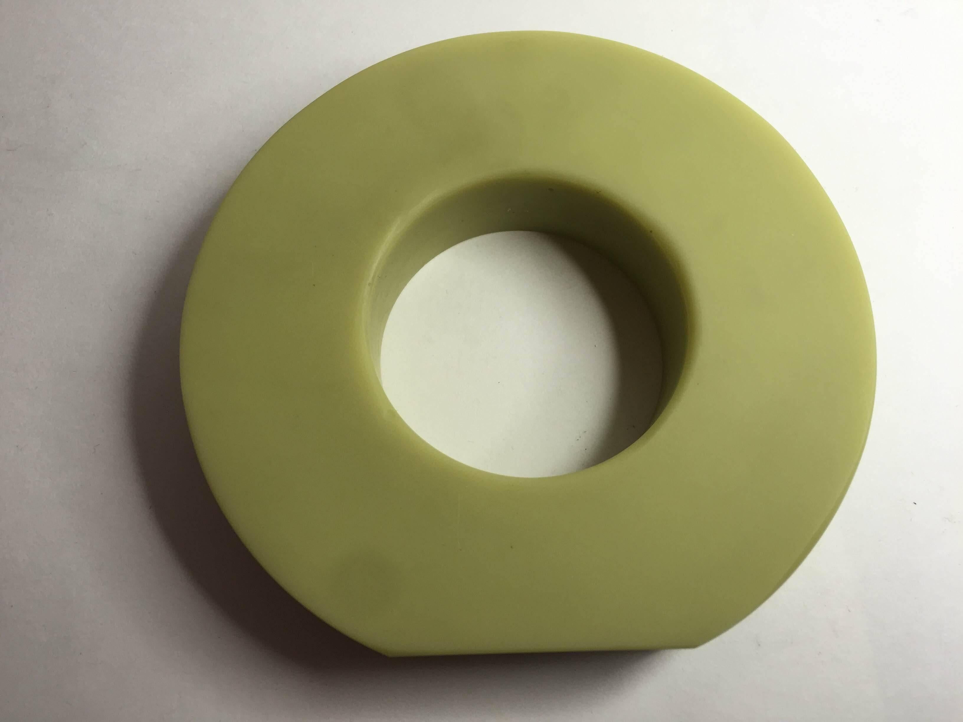 An important sculptural work of art, this resin bangle bracelet by artist and designer Martha Sturdy of Vancouver BC Canada is an amazing rich celadon celery green color in matte resin   It is massive.  It measures 2.4