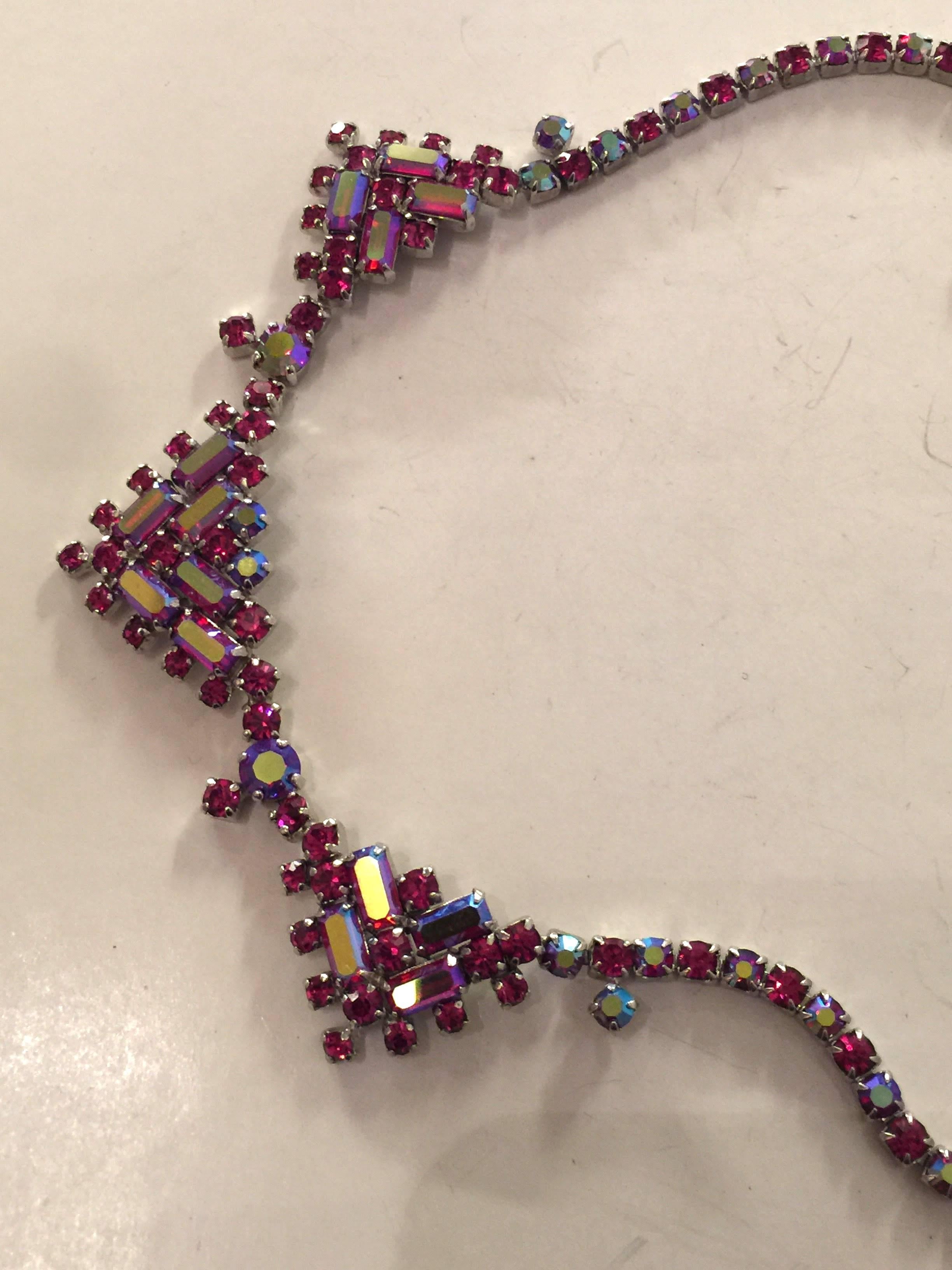 Canada's most collectible designer costume jewelry maker, this 1960s SHERMAN Red Aurora Borealis Geometric Prong Rhinestone Necklace is essentially Sherman in design and tone. A straightforward linear necklace section continues to a central