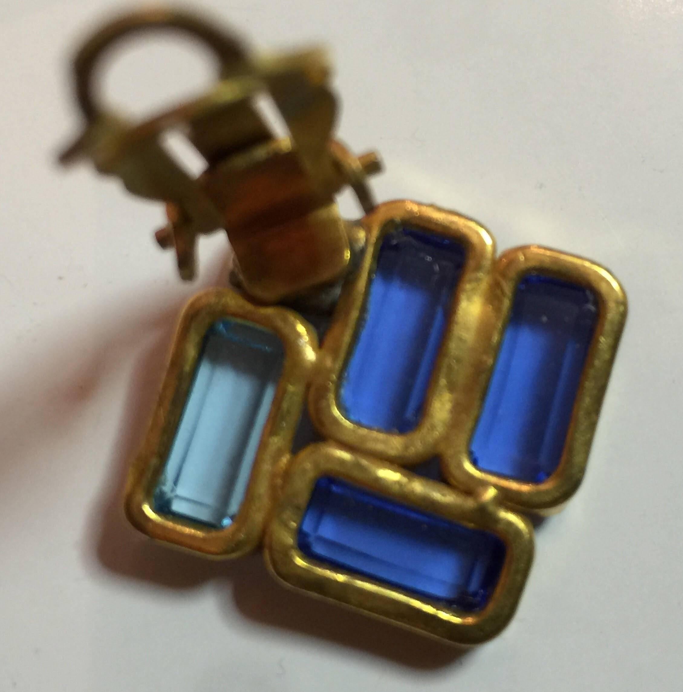 These 1970S William deLillo Gorgeous Azure Blue Clip Geometric Earrings are unsigned, but definitely attributed and guaranteed to be the work of deLillo. The chased settings are reflective of the artist's style, as is the combination of several