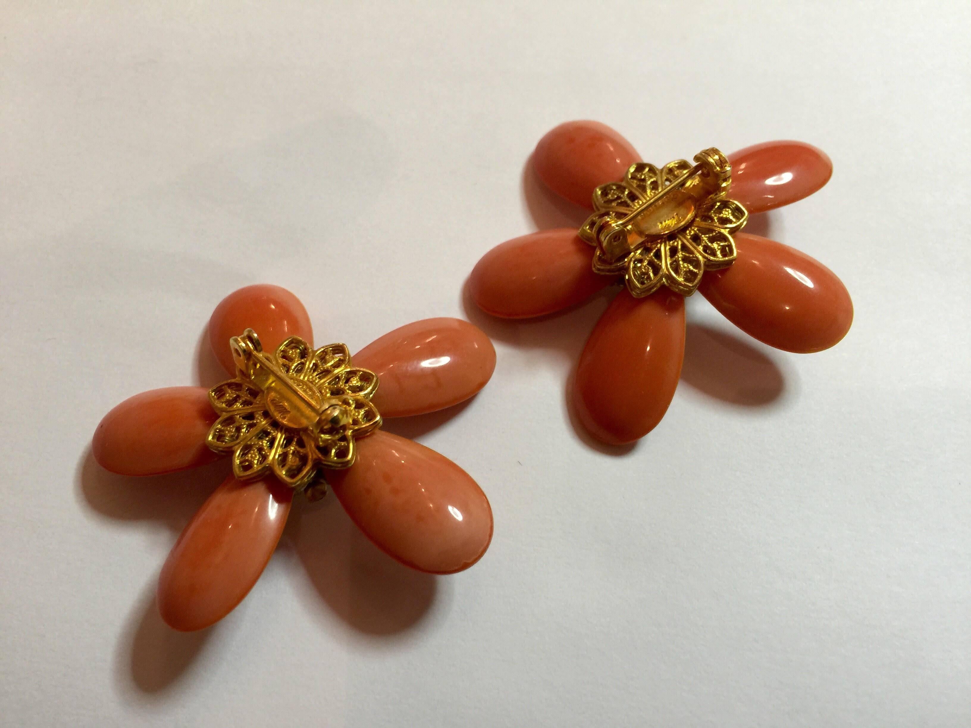 The noted jewelry designer William deLillo has a wealth of formats he works in to achieve glamour and elegance in his jewelry designs. This pair of flower pins, which ressemble star forms, are elegant and glmaorous in a way not dissimilar from