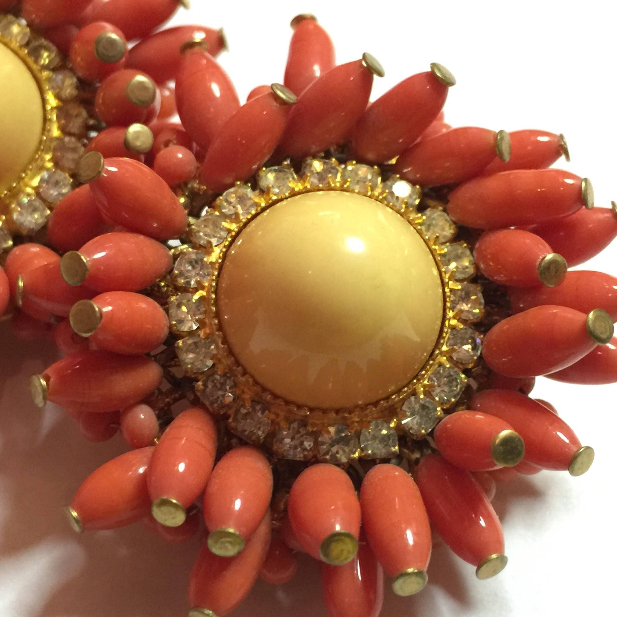 These Fabulous 1960s  DeLillo Faux Coral and Diamond Clipback Earrings are ultra lavish and utterly luxuriant. Brass tipped opaline coral glass teardrop beads surround a bream colored bullet cabochon surrounded by a circlet of lovely diamantes. The