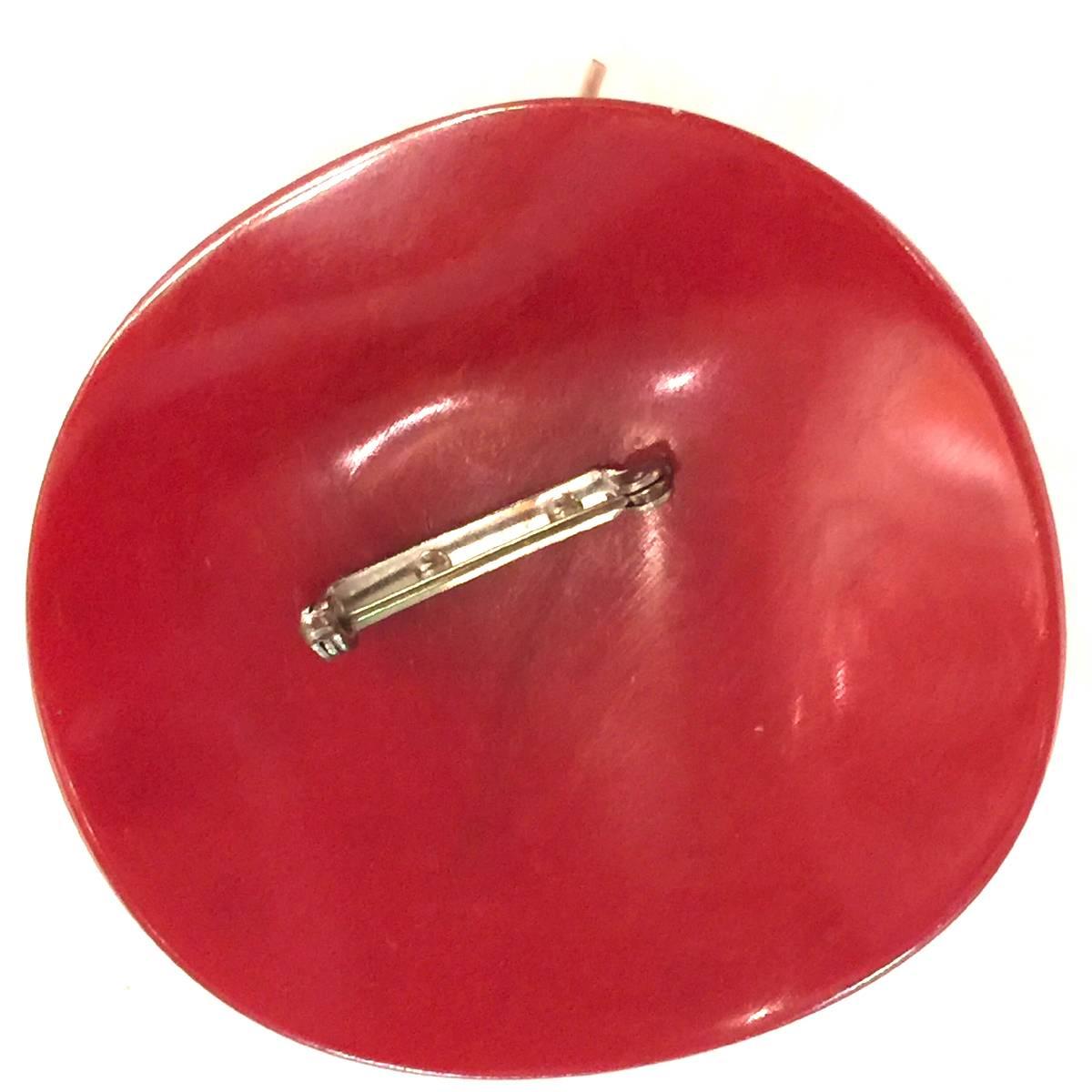 Another variant on the figural bakelite hat pin/brooch is the polka dotted version with gimp accent around the crown. The polka dots are painted on in an overall pattern, and show appropriate very minor wear as an original piece almost 90 years old.
