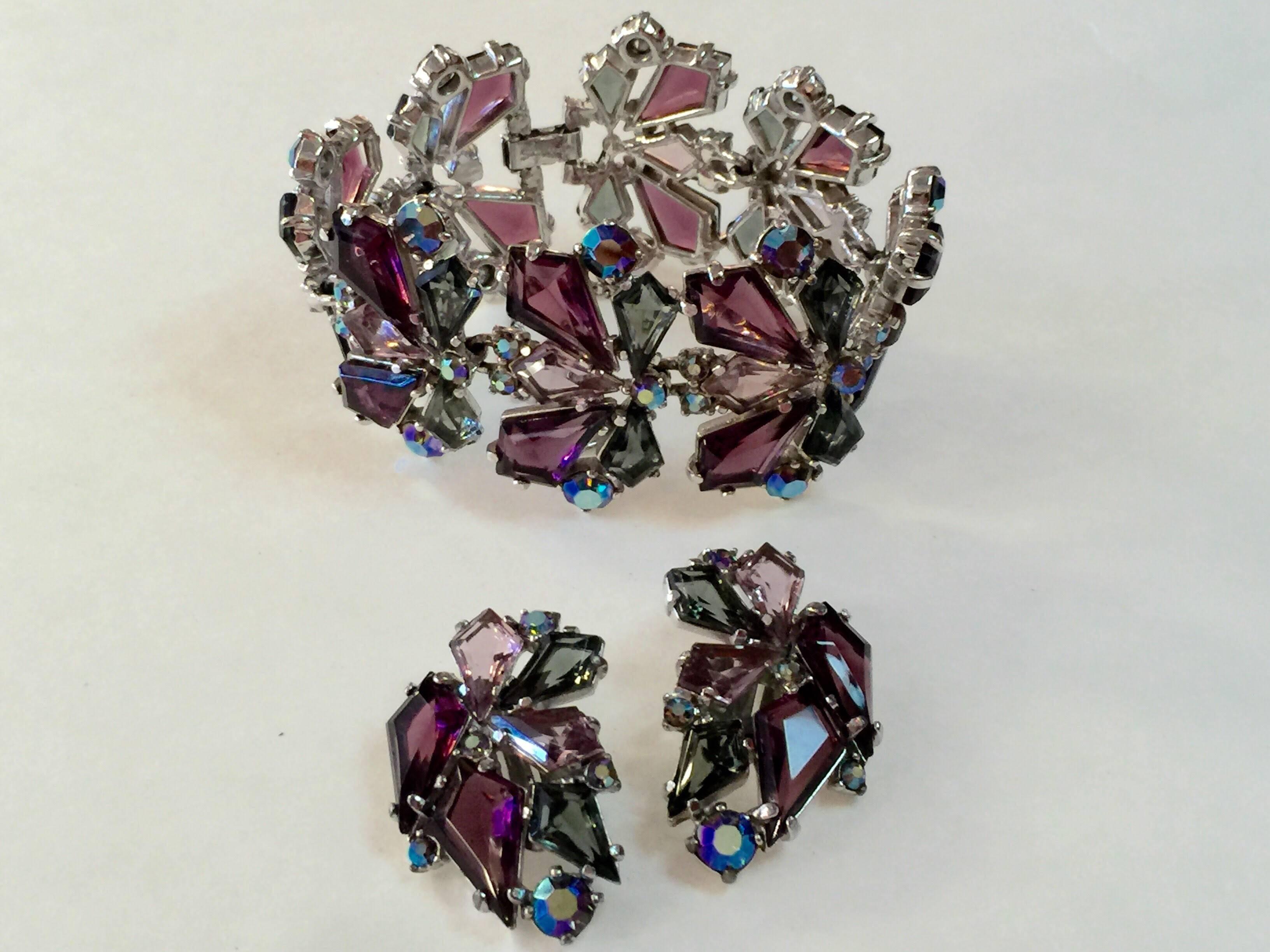 Magificent Costume Jewelry always commands attention and this RARE Schiaparelli Link Bracelet with coordinate Clip On Earrings Set does not disappoint. A sophisticated tonal array of soft lilac purple as well as rich deep amethyst purple, and subtle