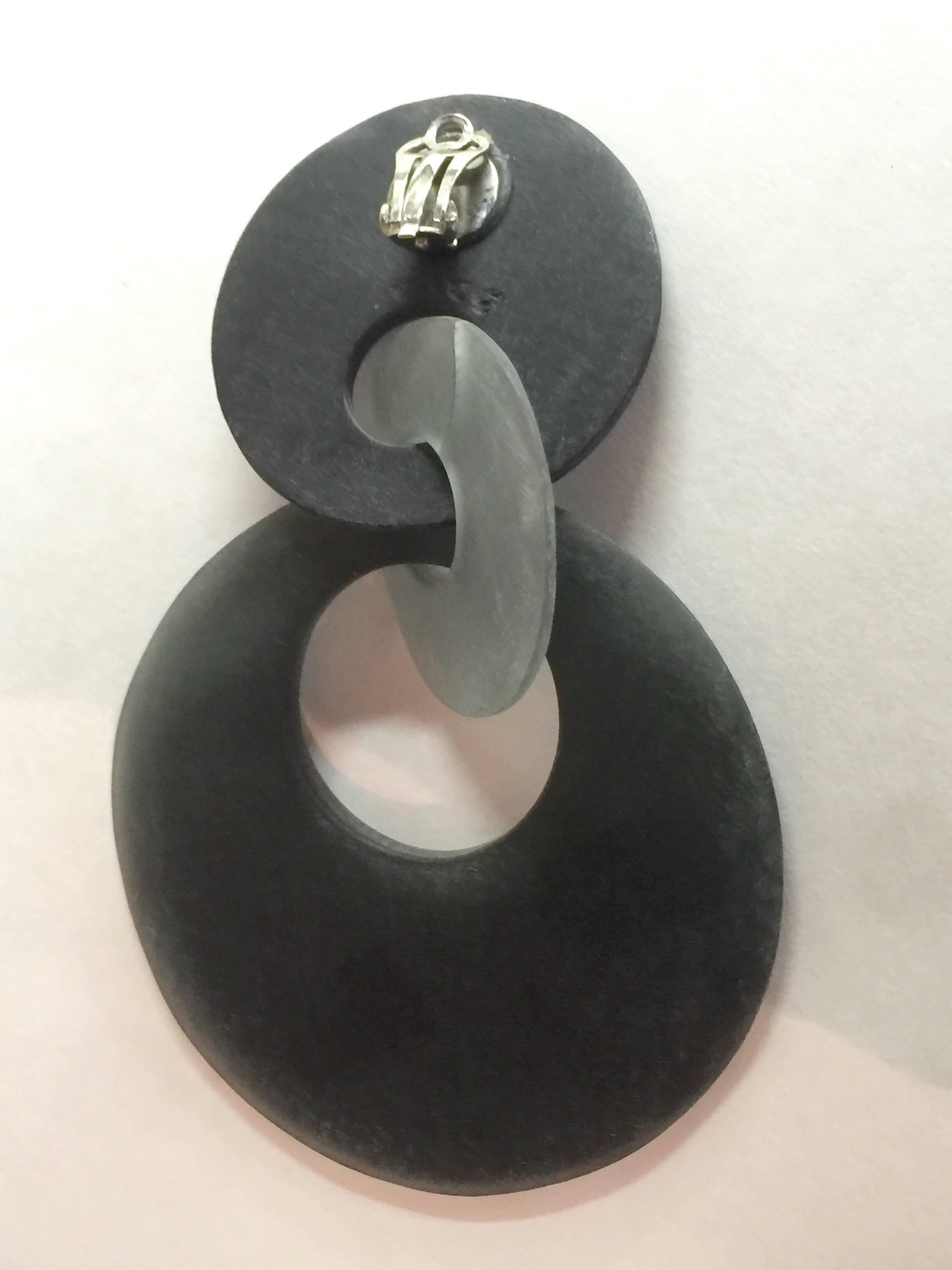 Stylish and sleek these Danish MONIES Gerda Lyngaarrd Matte Frosted Resin Geometric Drop Clip Earrings are super space age yet utterly organic and natural in tone. 2 pierced circles of subtly different gray hued matte frosted resin is interconnected