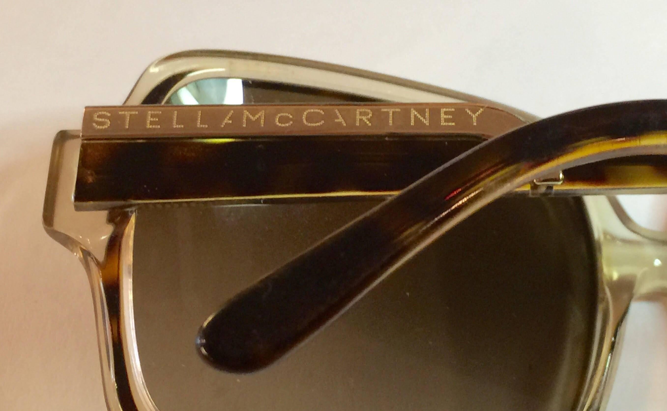 21st Century Designer Sunglasses by noteworthy British designer Stella McCartney. Shades of clear amber and torotise layered make these oversized dunoptics wonderful and highly wearable. Original box included.