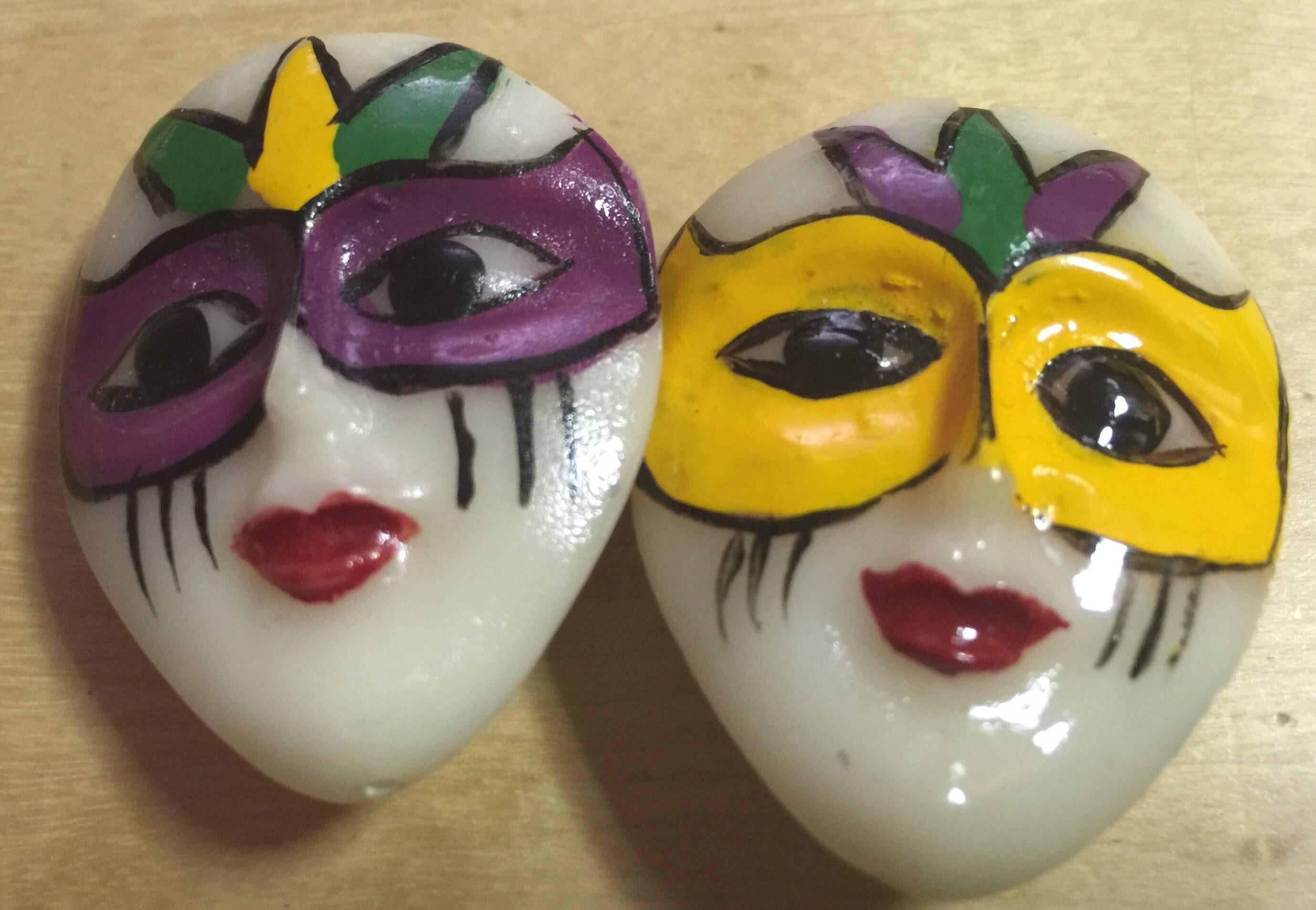 These 5 glossy polished celluloid buttons are of the French phantasmogotic creature PIERROT. Brightly painted and detailed, the masks of color add verve to these whitish coat buttons. Each is 3 dimensional --the same on the front and the rear, and