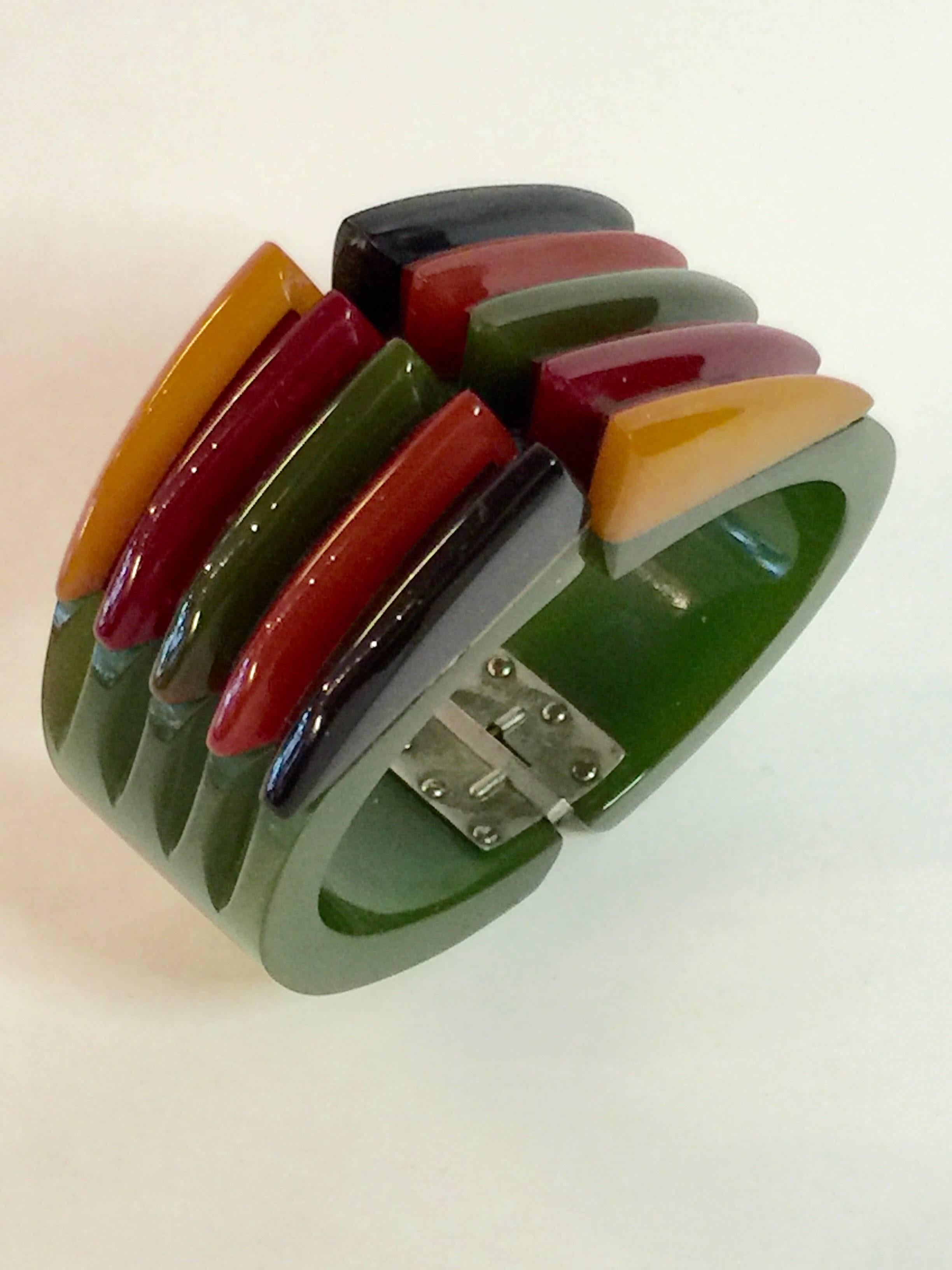 Universally acclaimed the Iconic 1930s Bakelite Multicolor Geometric PHILADELPHIA Hinged Bracelet is a holy grail for many who are drawn to the special allure of fine bakelite jewelry. An oversized almost 3" wide at its widest point center