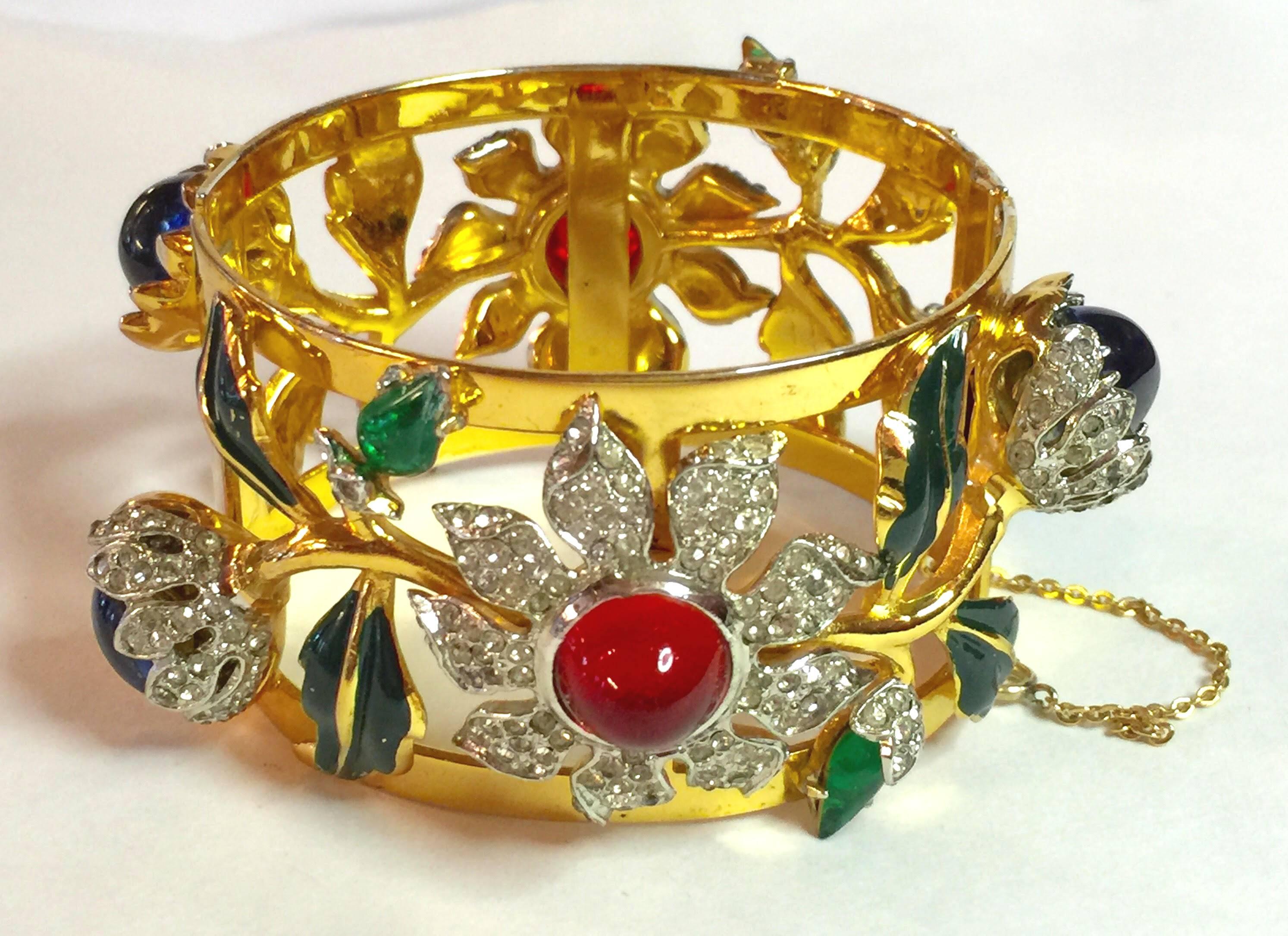 Gloriously gilt, this CoroCraft Sterling Carmen Miranda Bracelet with Diamante and Gem Tone Cabochons is among the most iconic of all 1940s retro vintage costume jewelry designs ever created. Over 2.5  inches wide with a tongue and groove clasp,