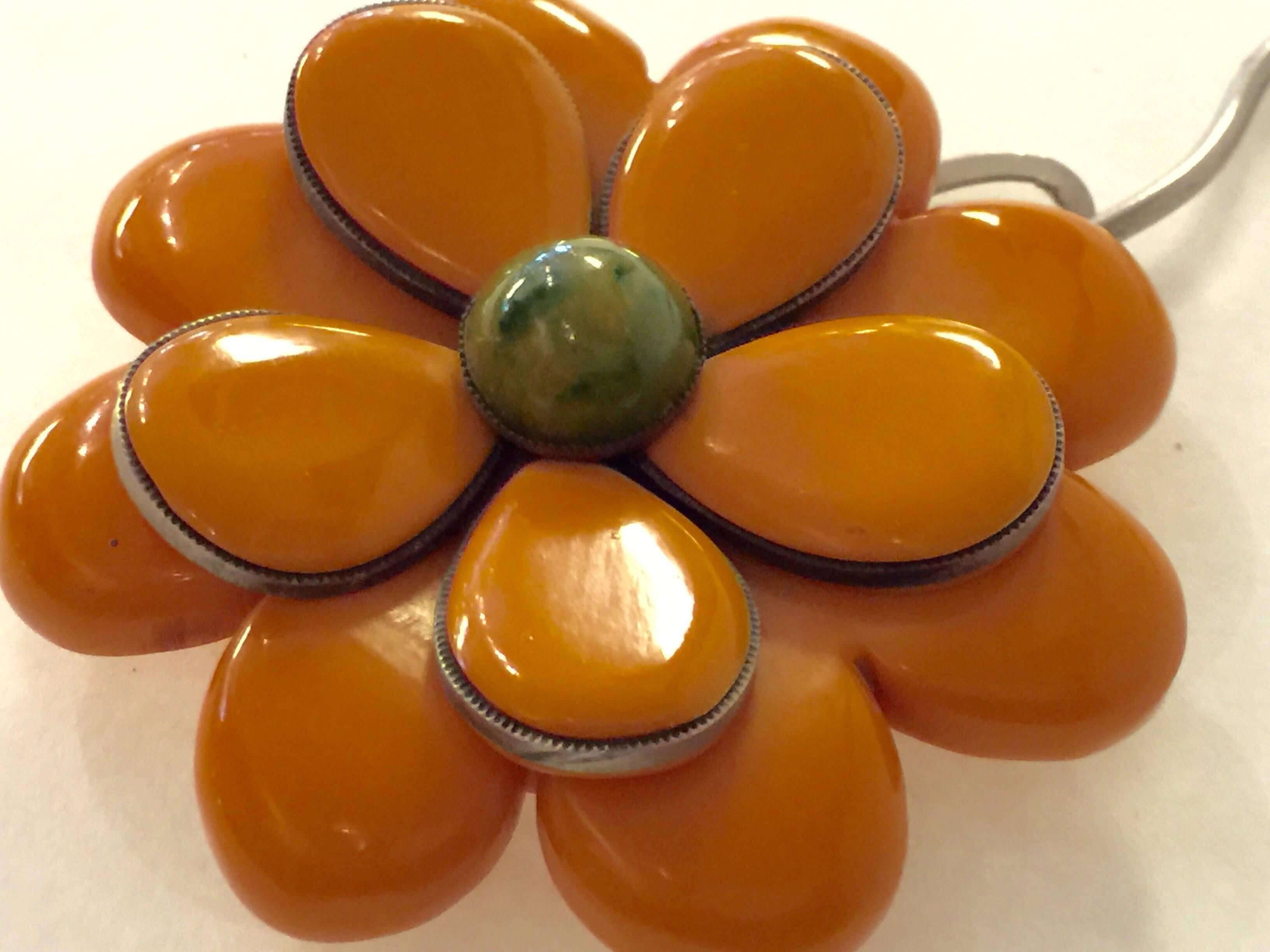 Highly unusual construction is the hallmark of this oversized fun and fabulous butterscotch and green bezel set petals bakelite flower spring loaded LARGE dress clip. An unusual wedding cake built up construction is practically one-of-a-kind----and