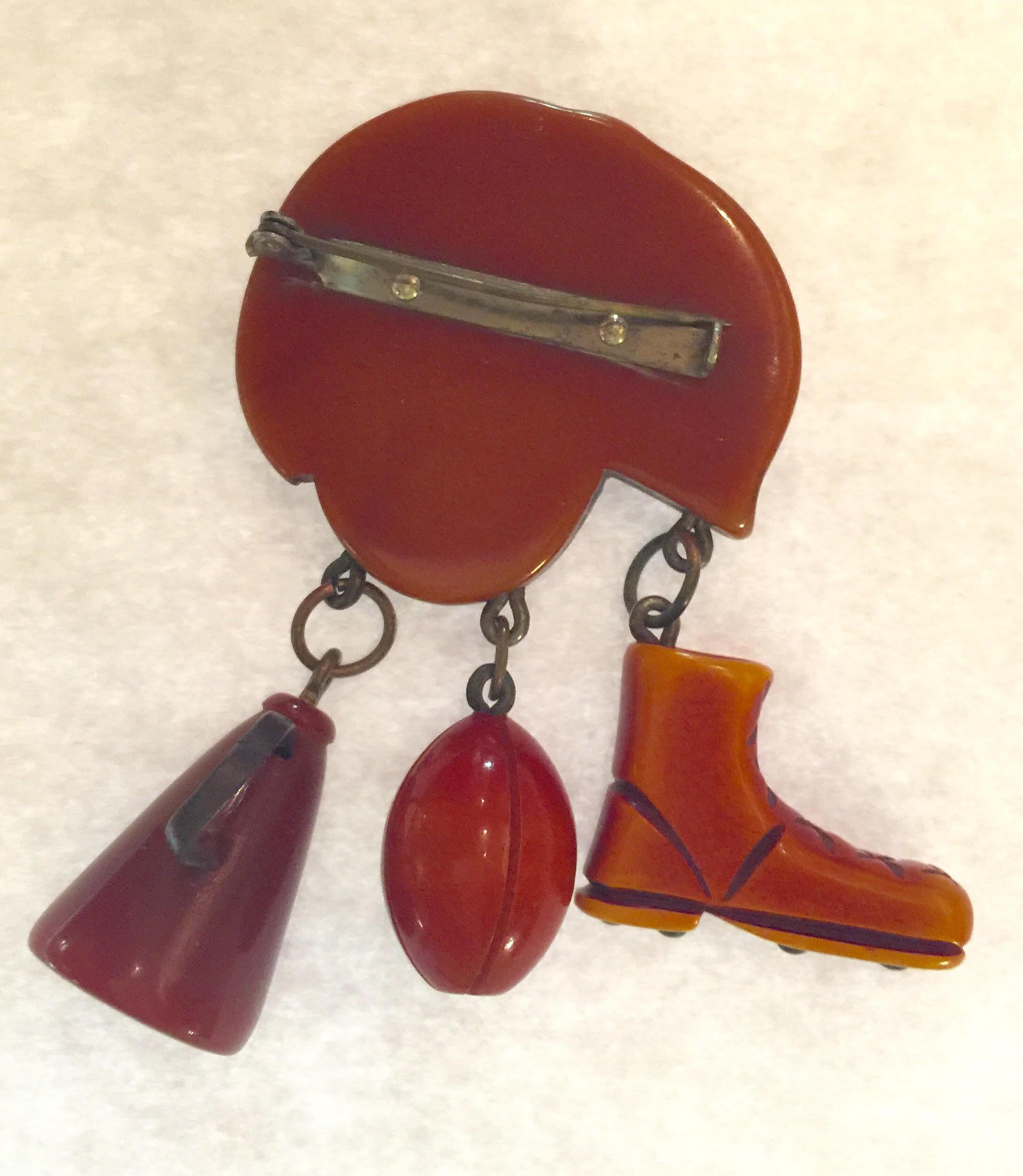 Women's or Men's 1930s Resin Washed Bakelite Figural Football Brooch/Pin Thematic Charm Drops For Sale