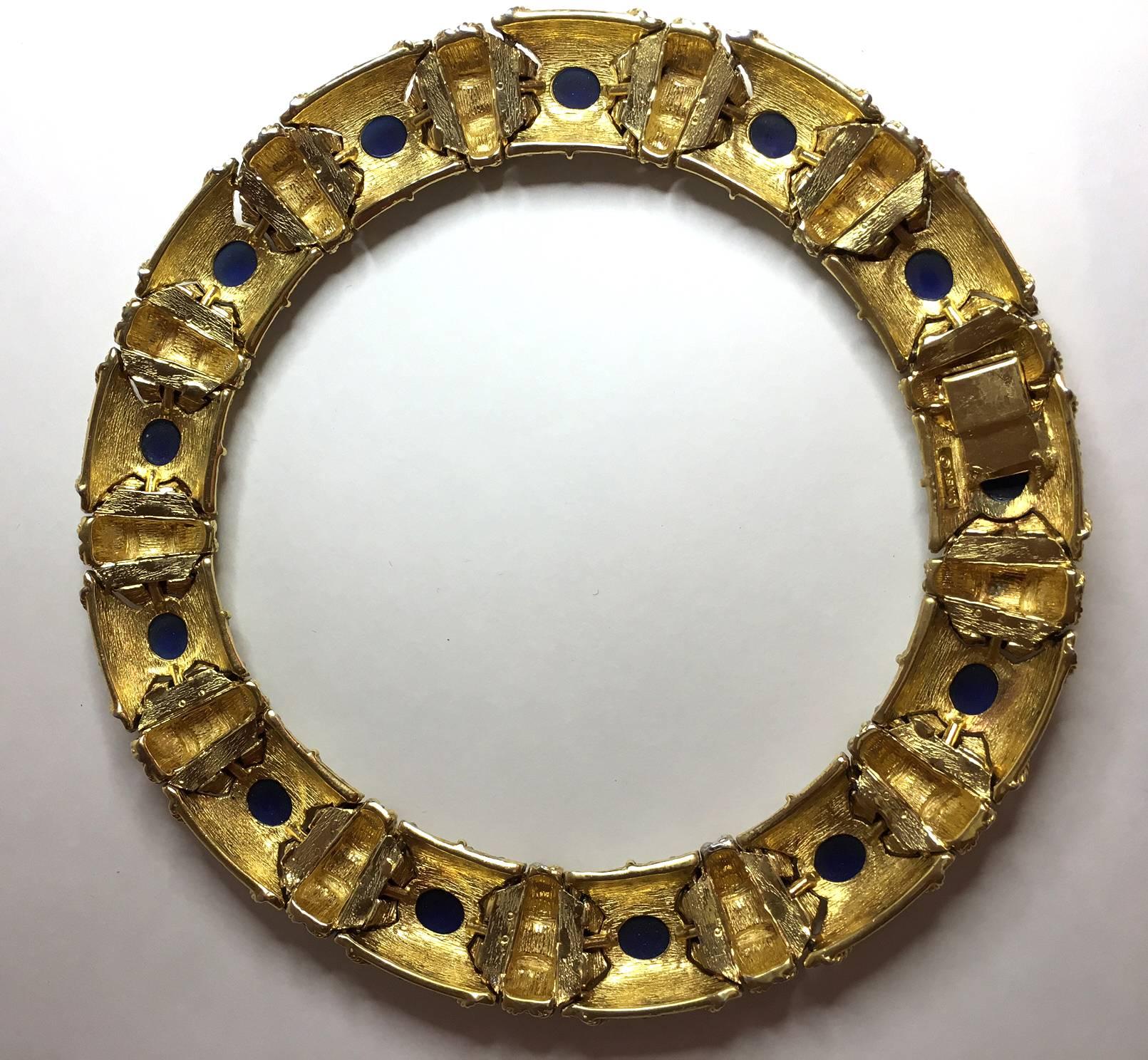 Fine costume jewelry by Ciner is as lovely and appears quite genuine in comparison to many other makers or manufacturers. This amazing perfectly circular semi-rigid necklace combines gold tone settings with amazing full paved surfaces and