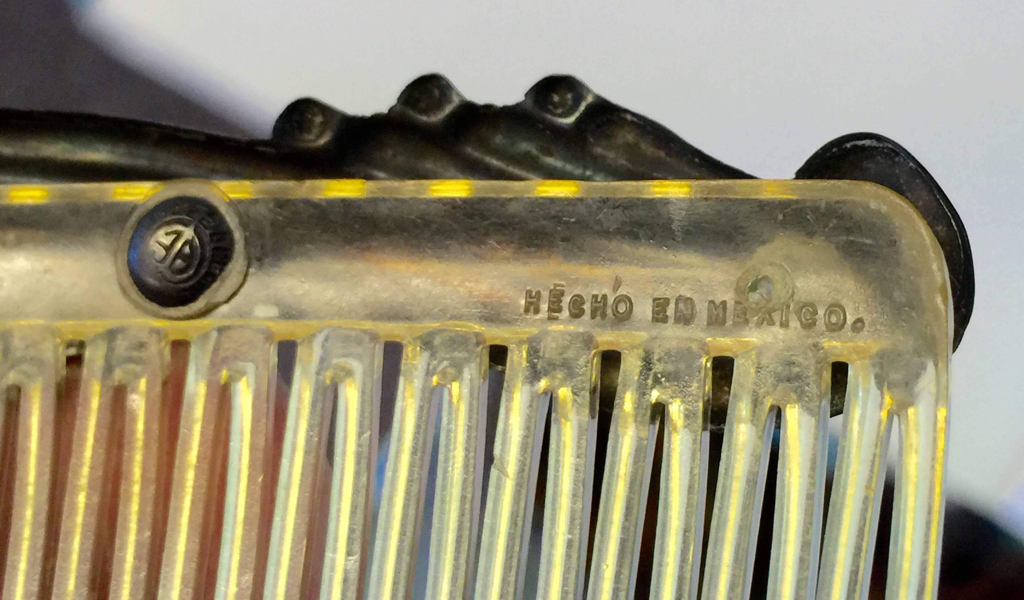 This 1960s PAIR Mexican Celluloid and Sterling Silver Hair Combs are in excellent condition and are signed Hecho in Mexico and have an artists signature in a central circular section on the rear of the comb. Almost 3.5