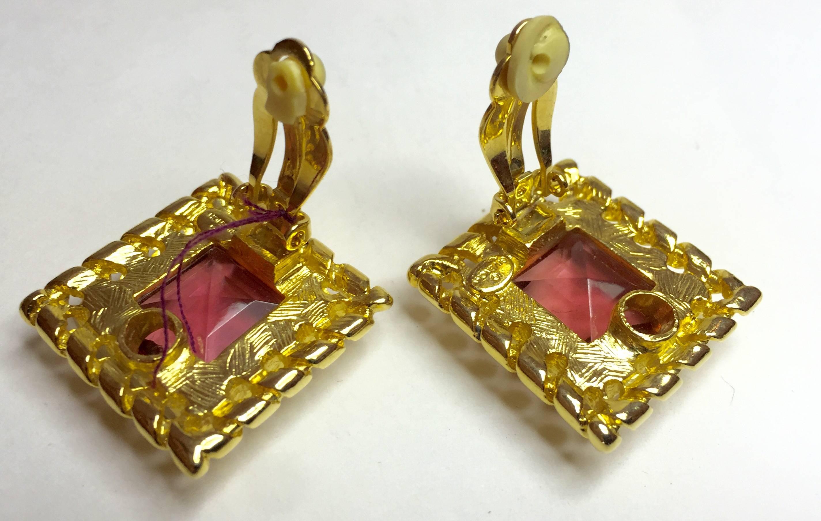 These lovely 1980s GIVENCHY clip on earrings are sleek and tailored goldtone metal, with luscious pink crystal square cut stonework. Faceted, brilliant and bright, the clip on earring mechanism is original and functions perfectly. The frame appears