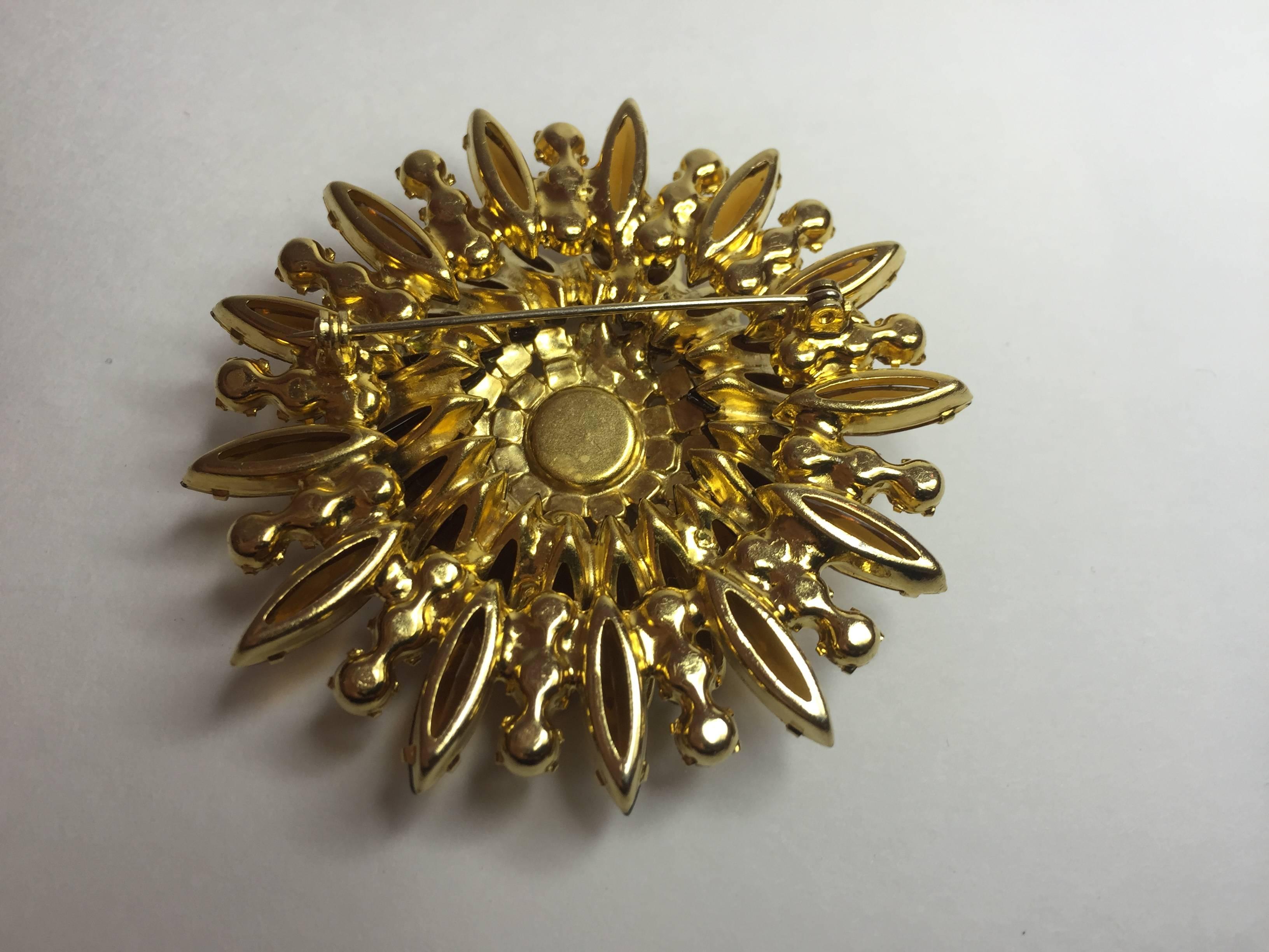 A classic 1960s Delizza and Elster D & E NavetteTopaz BURST Brooch Pin, constructed wedding cake style built up to achieve optimal sculptural presence on its wearer. Approximately 2.25