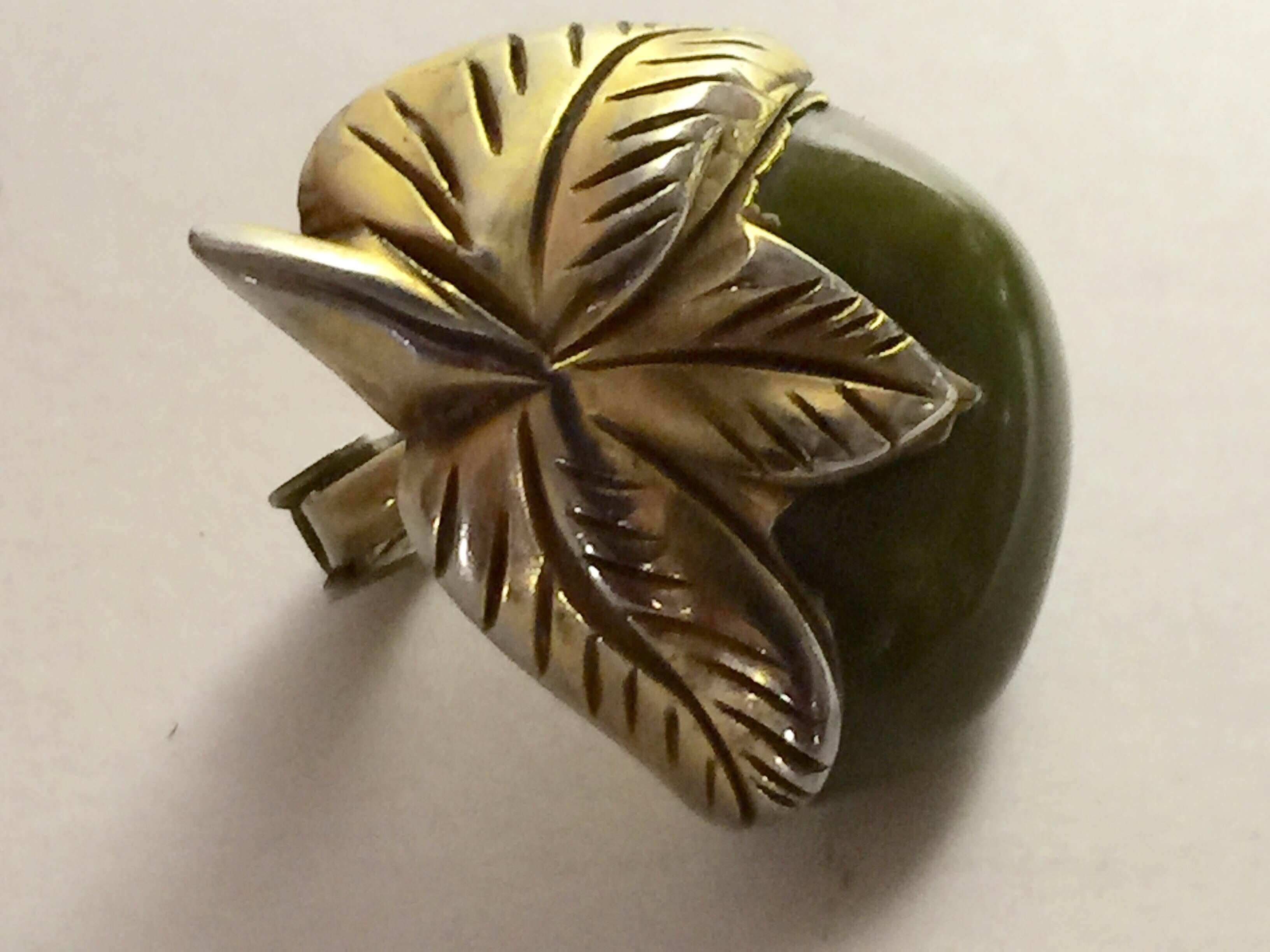 The unusual sub niche category within carved and figural bakelite jewelry pictured here is called CLAD Bakelite. Made in Canada for the more conservative market there, it attempted--- by wrapping gold foil metal around bakelite sometimes obscuring