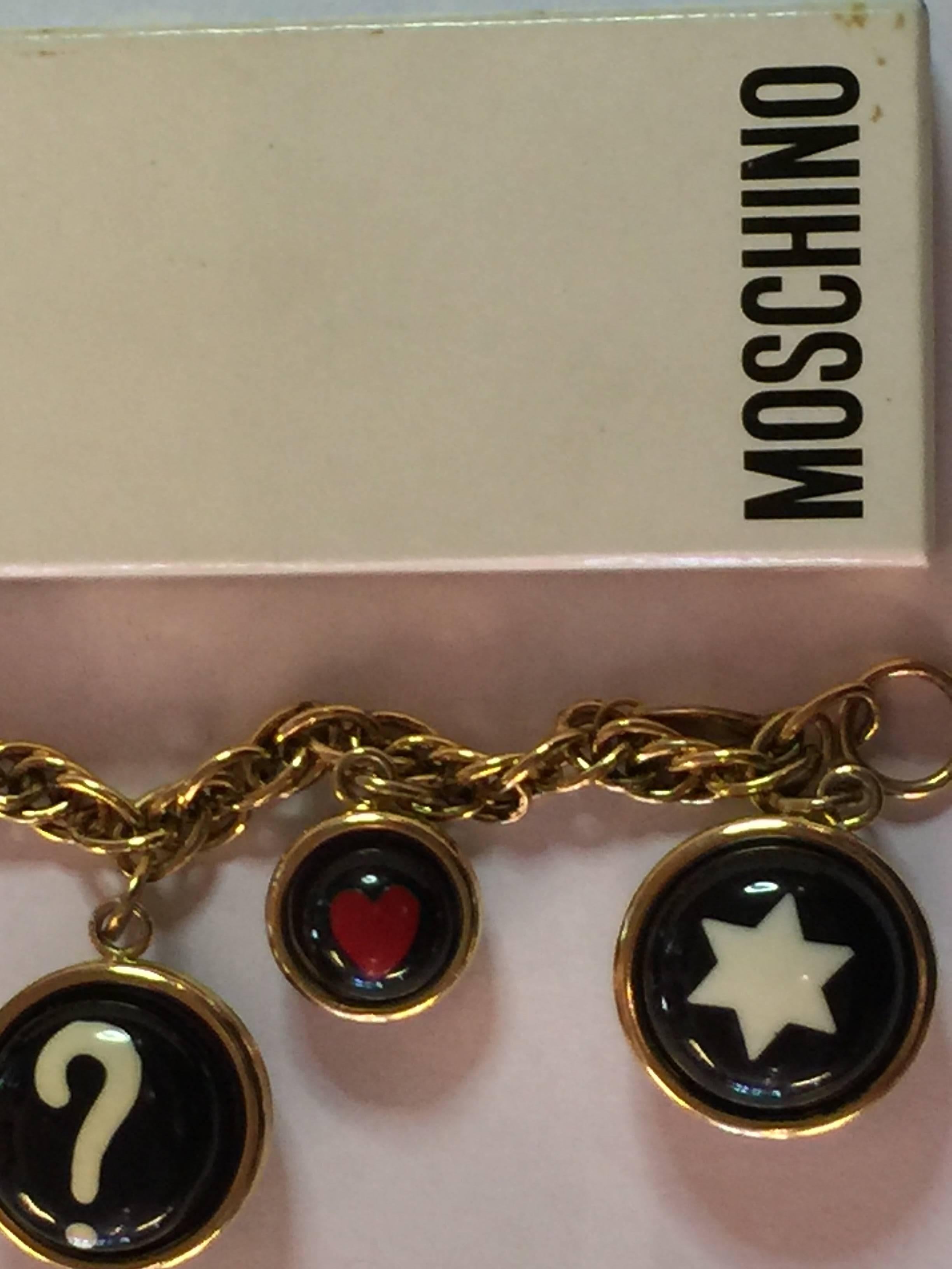This iconic MOSCHINO charm bracelet utilizing iconic and favorite symbols, the question mark, the heart and the star are enblematic of the jewelry of this storied European fashion designer. Mosly famous for haute coture and eccentric and humorous