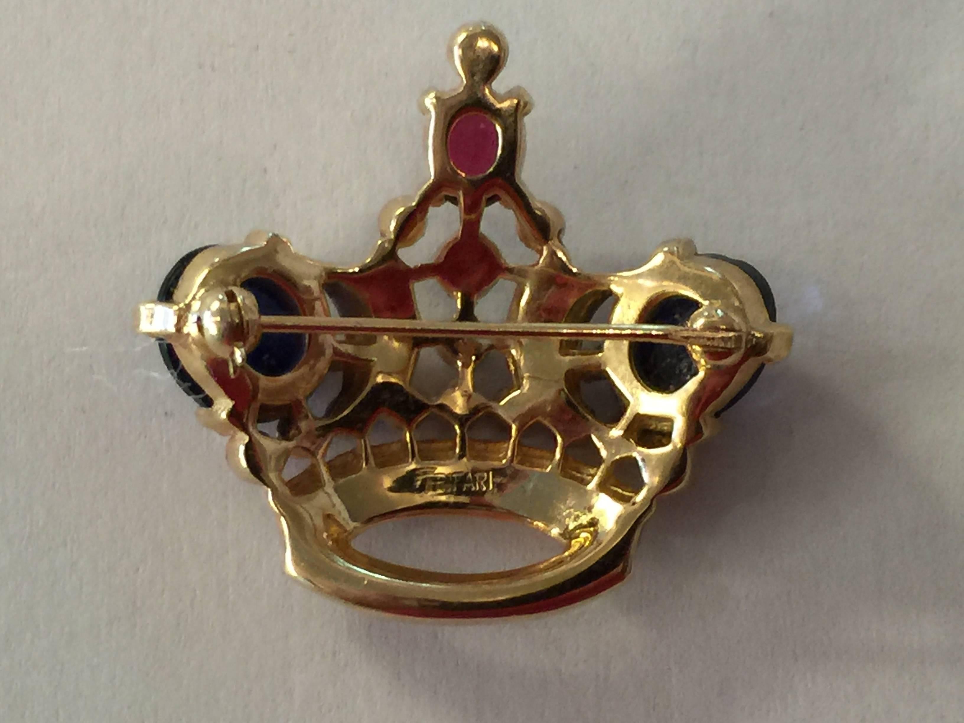 Possibly the most well know brooch made by TRIFARI, this crown pin brooch is done in the small size and is perfect and pristine, constructed of dazzling large and small multi colored cabochons, ovals and round stones. Approximately 1