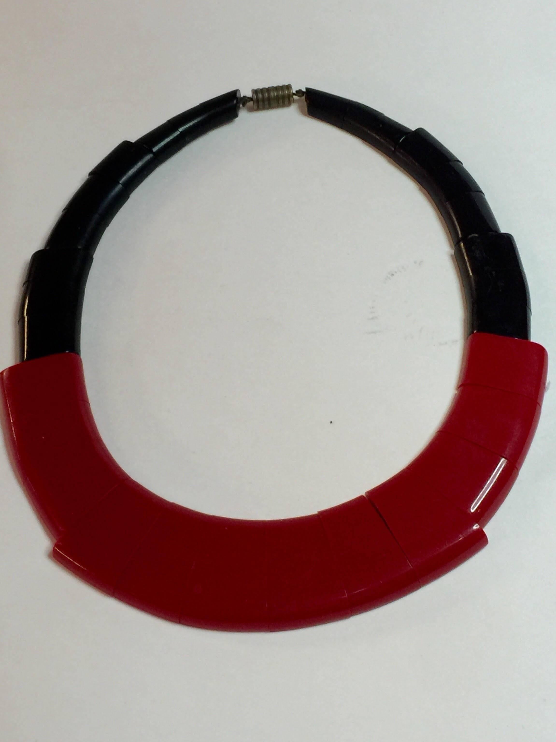 Art Deco Moderne master August Bonaz worked in Galalith in France in the 1930s and created some of the sleekest most beautifully engineered luxury resin and chrome jewelry anywhere, anytime. This gorgeous flat bibb necklace is comprised of elements