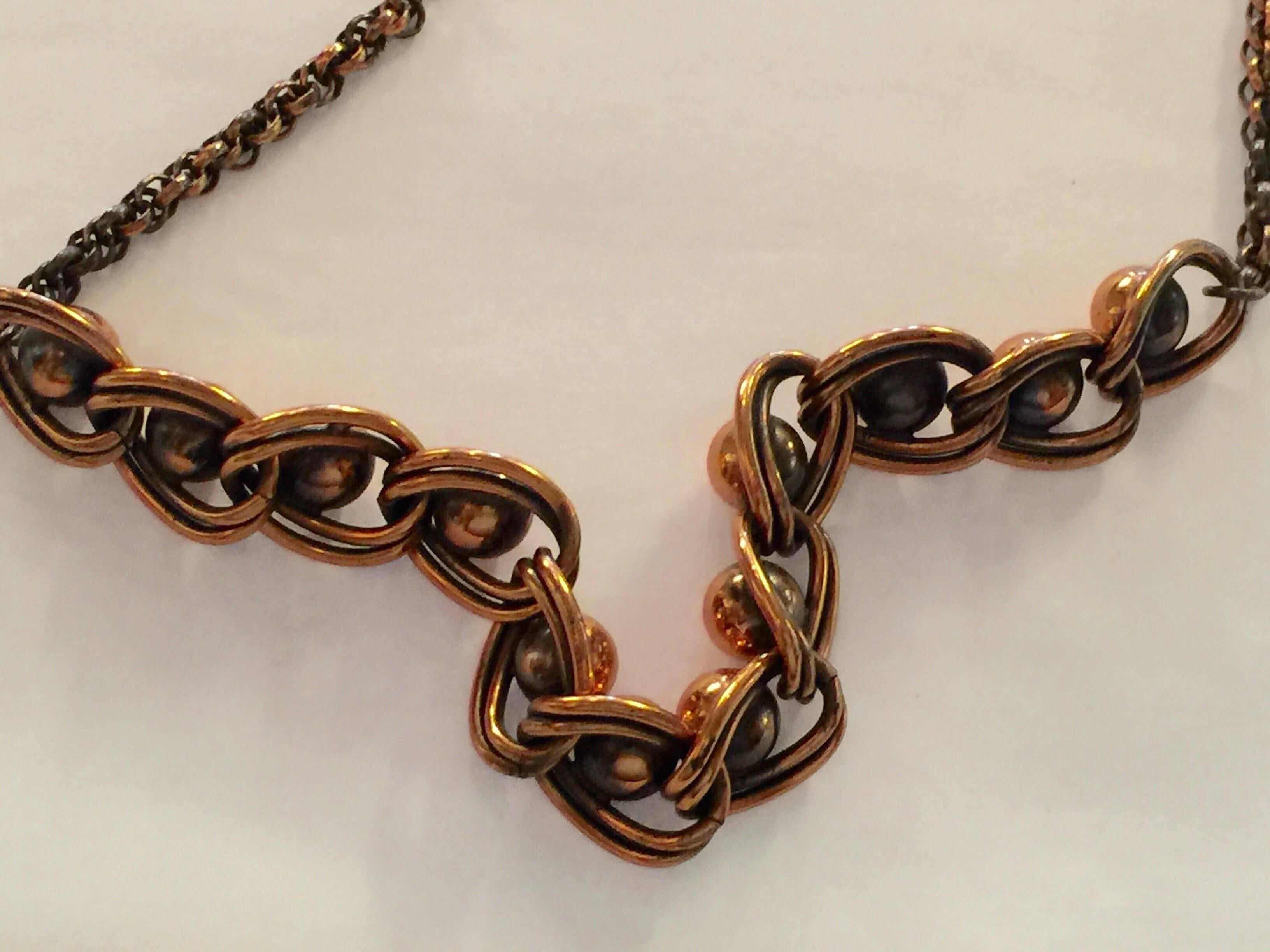 This Copper Ball Bearing Double Chain Mid Century Modernist Necklace is by noted NYC artist and acknowledged modernist master crafstman Frank Rebajes. Although known for a variety of both ethnogrphic, naturalistic as well as modernist design