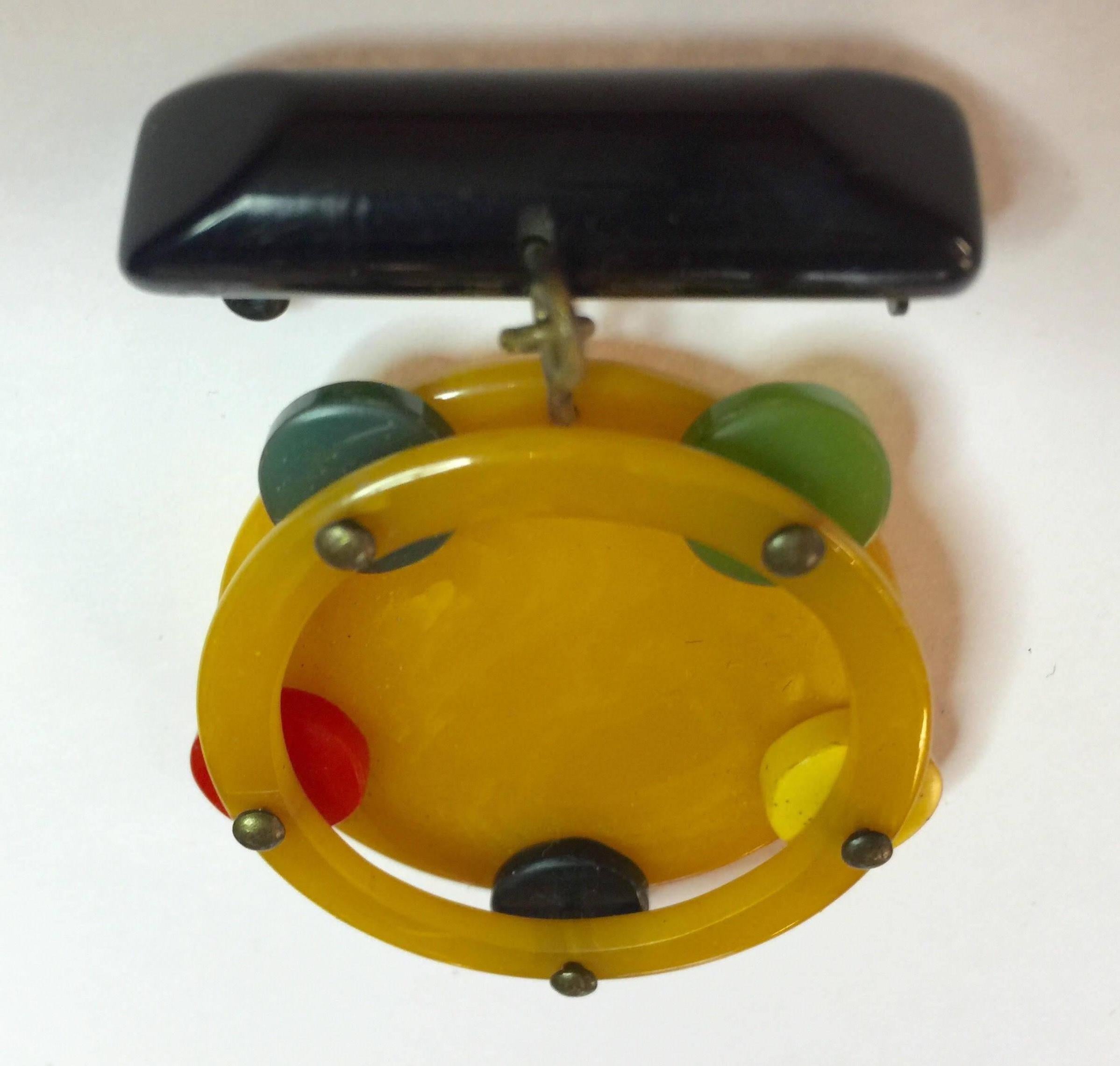 Women's 1930s Multicolored Bakelite Figural Tambourine Dangling from Bar Brooch Pin For Sale