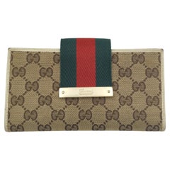 Gucci tan monogram canvas continental wallet