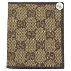 Gucci monogram brown leather sliding cardholders