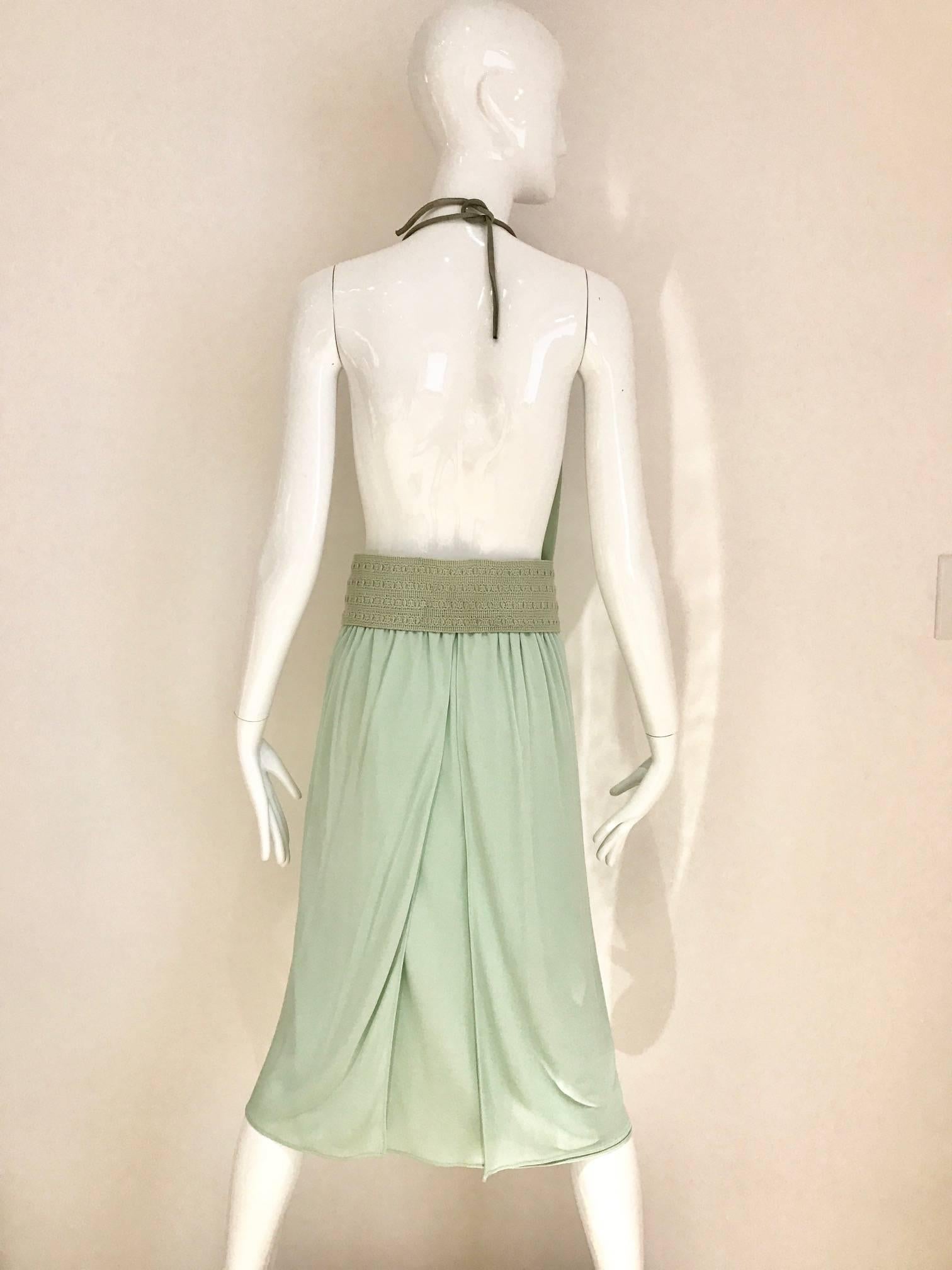 Sexy 1970s matte jersey cowl neck open back dress with woven belt. 
Made in italy. fit size 4/6/ Elastic waist. Perfect for summer vacation.
Bust: open/ Waist: 26 inches to 30