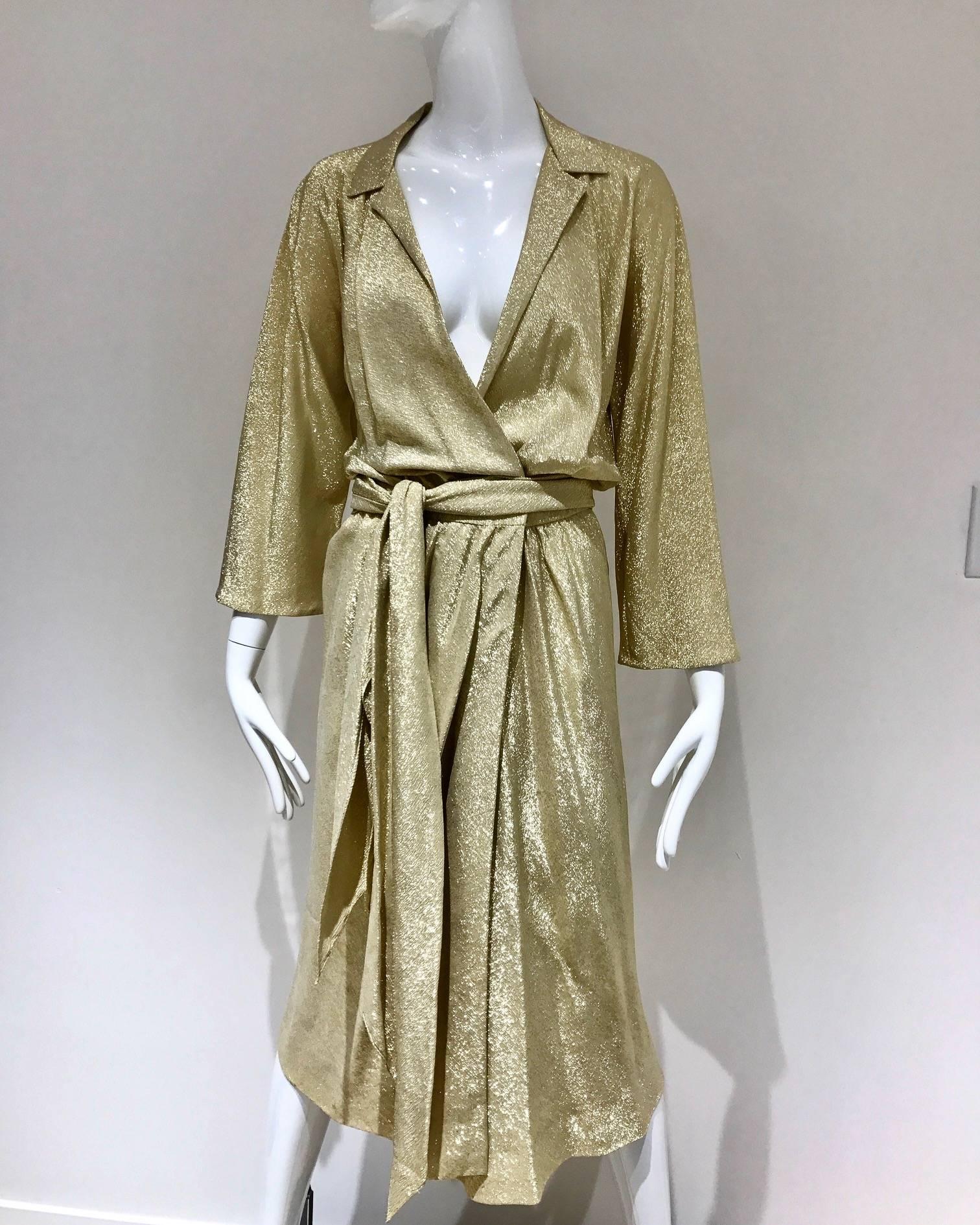 Iconic HALSTON 1970's gold silk lame wrap cocktail disco.  The gold metallic fabric wraps you in sparkling elegance and you will feel like you are going to Studio 54 that evening! The plunging v-neck and clingy draping creates a sexy look that will