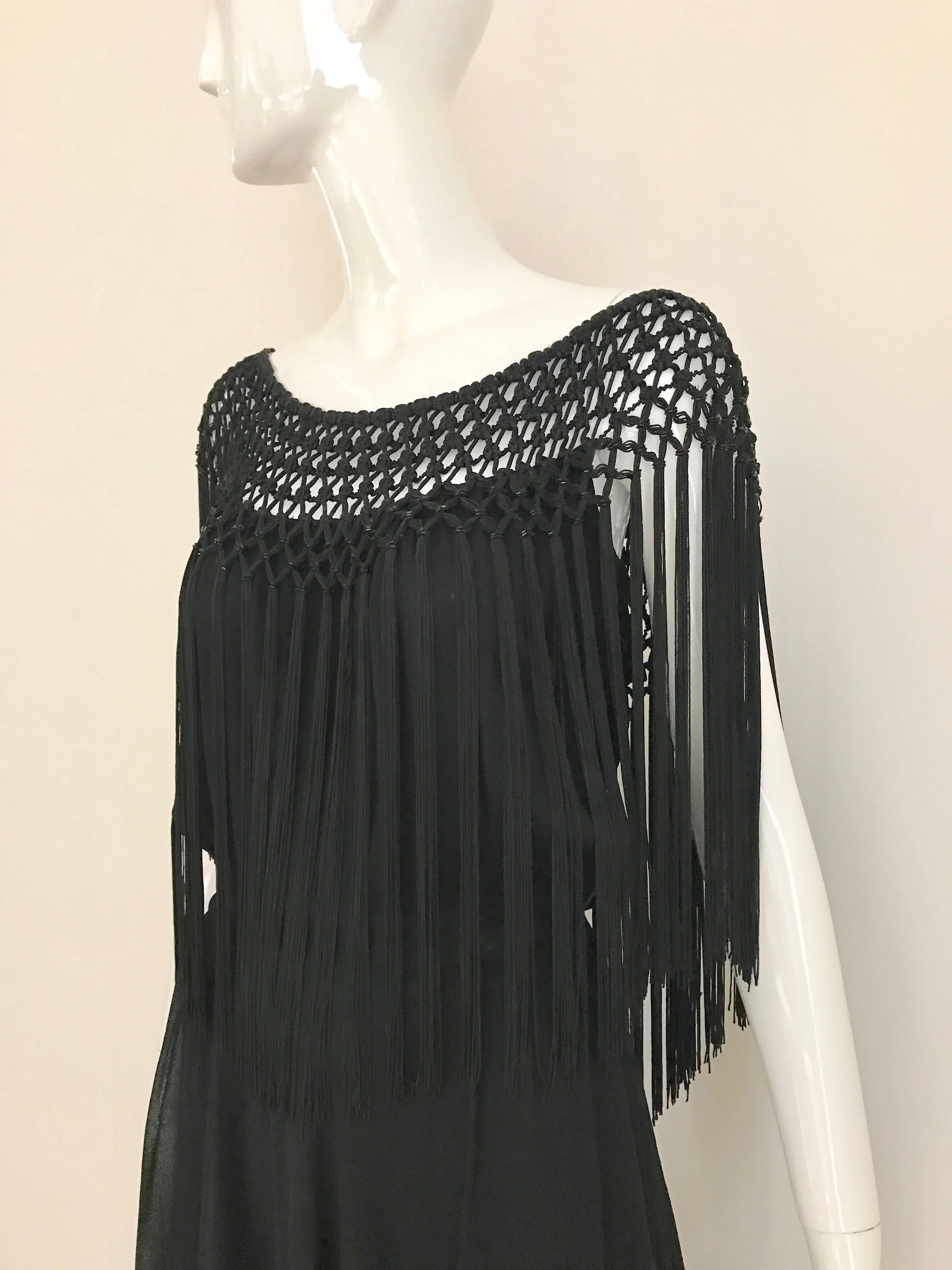 What a fun vintage Party cocktail dress! 1970s Black Silk dress with macrame silk  fringe.  Size 4
Bust: 36 inches
Waist: 26 inches