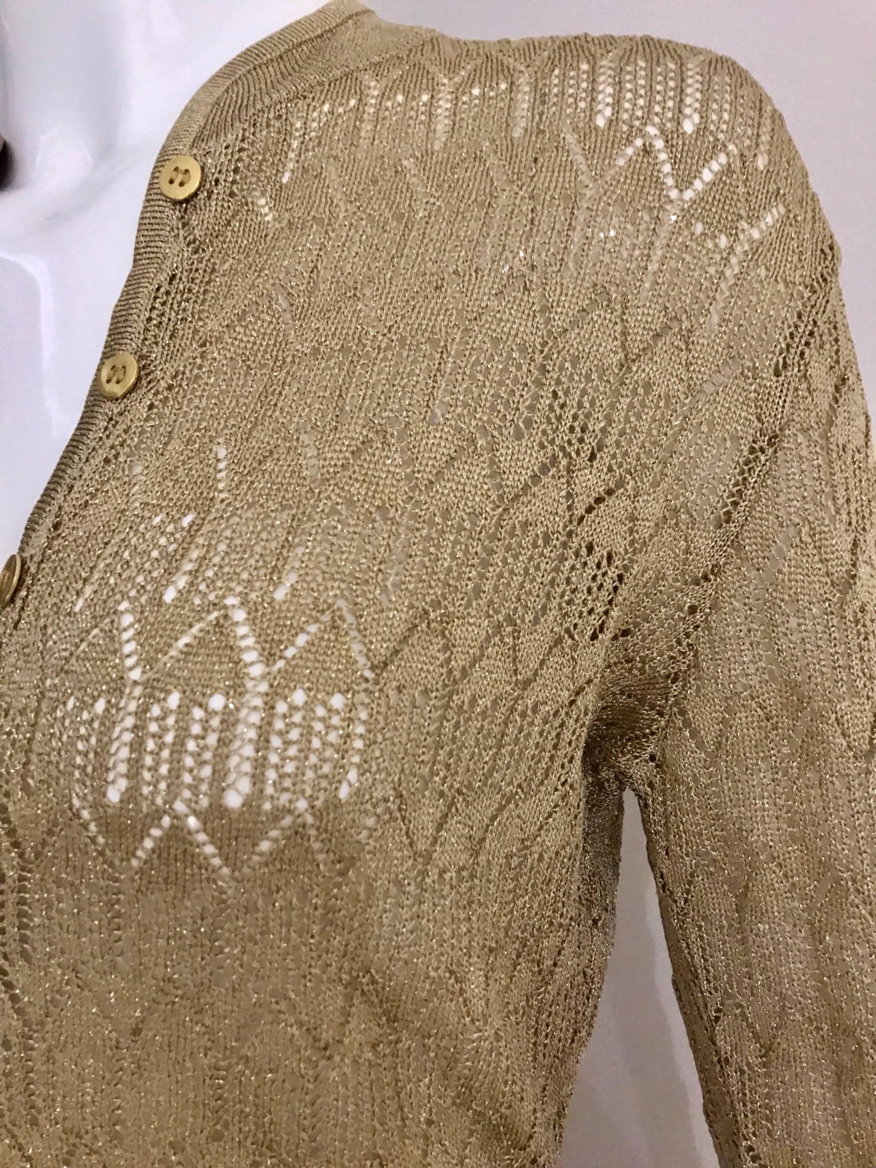 Gold metallic knit Christian Dior by John Galliano Cardigan and fitted long skirt set.
Fit Size 4

