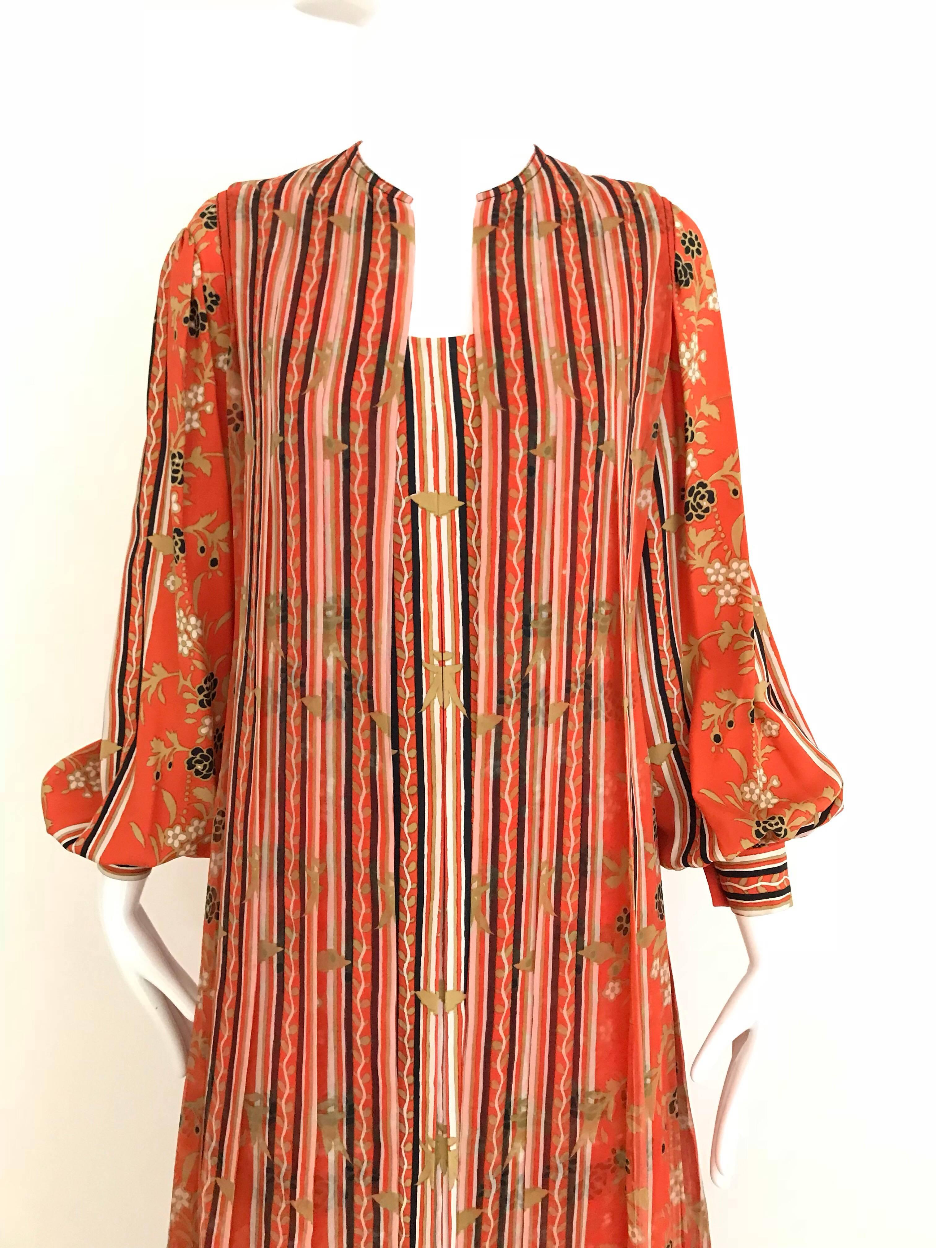 Beautiful vintage Galanos Orange and black floral print silk dress with maxi vest. 
Dress is lined in silk. 
Size 4 / Small
